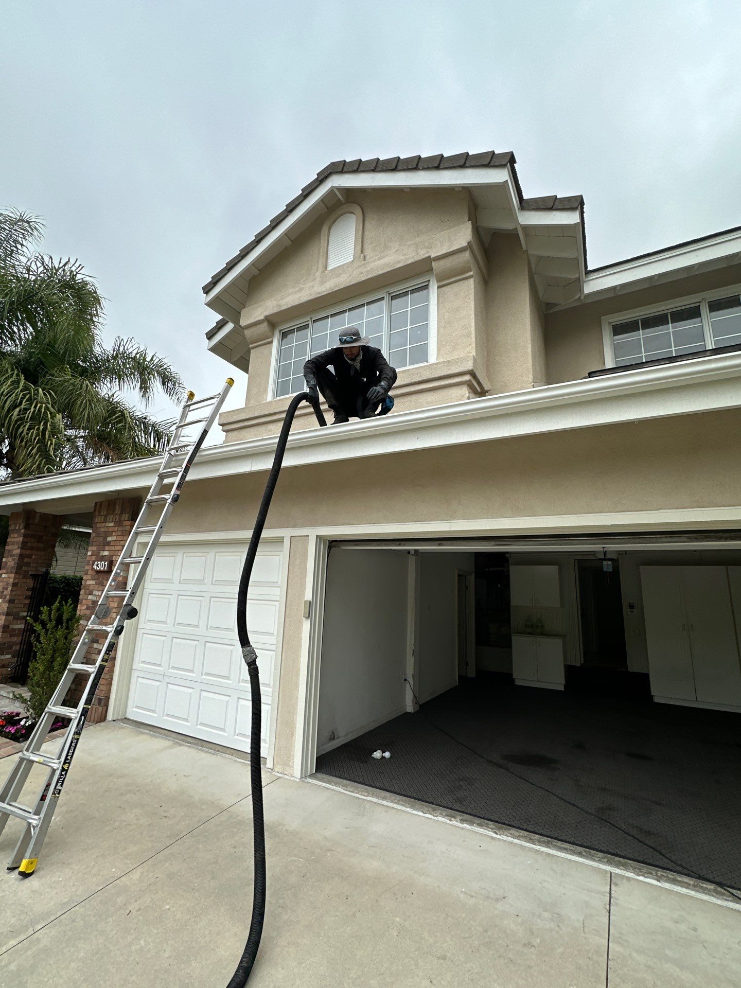 Gutter flush and window cleaning by Property Cleaning Experts, LLC