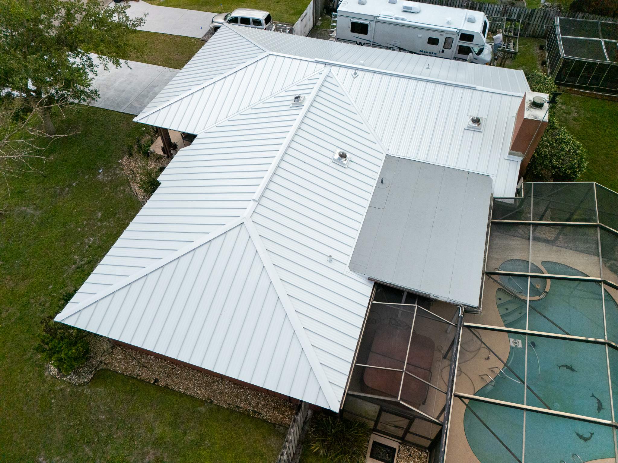White Standing Seam Metal Roof Replacement and Hurricane Reinforcement in Palm Bay, Florida by Wiedmann Construction & Roofing