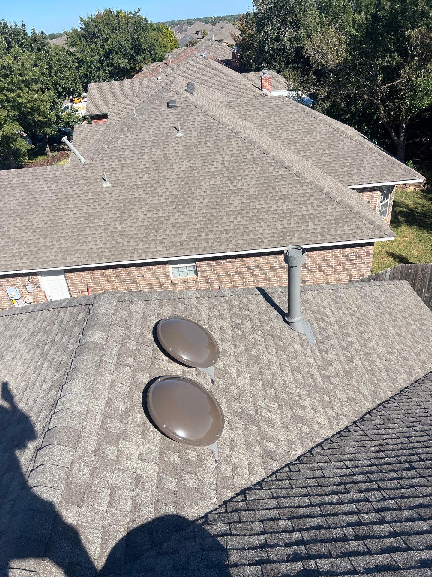 Roof Replacement and Gutter Installment in Edmond, OK by McCann's Roofing and Construction