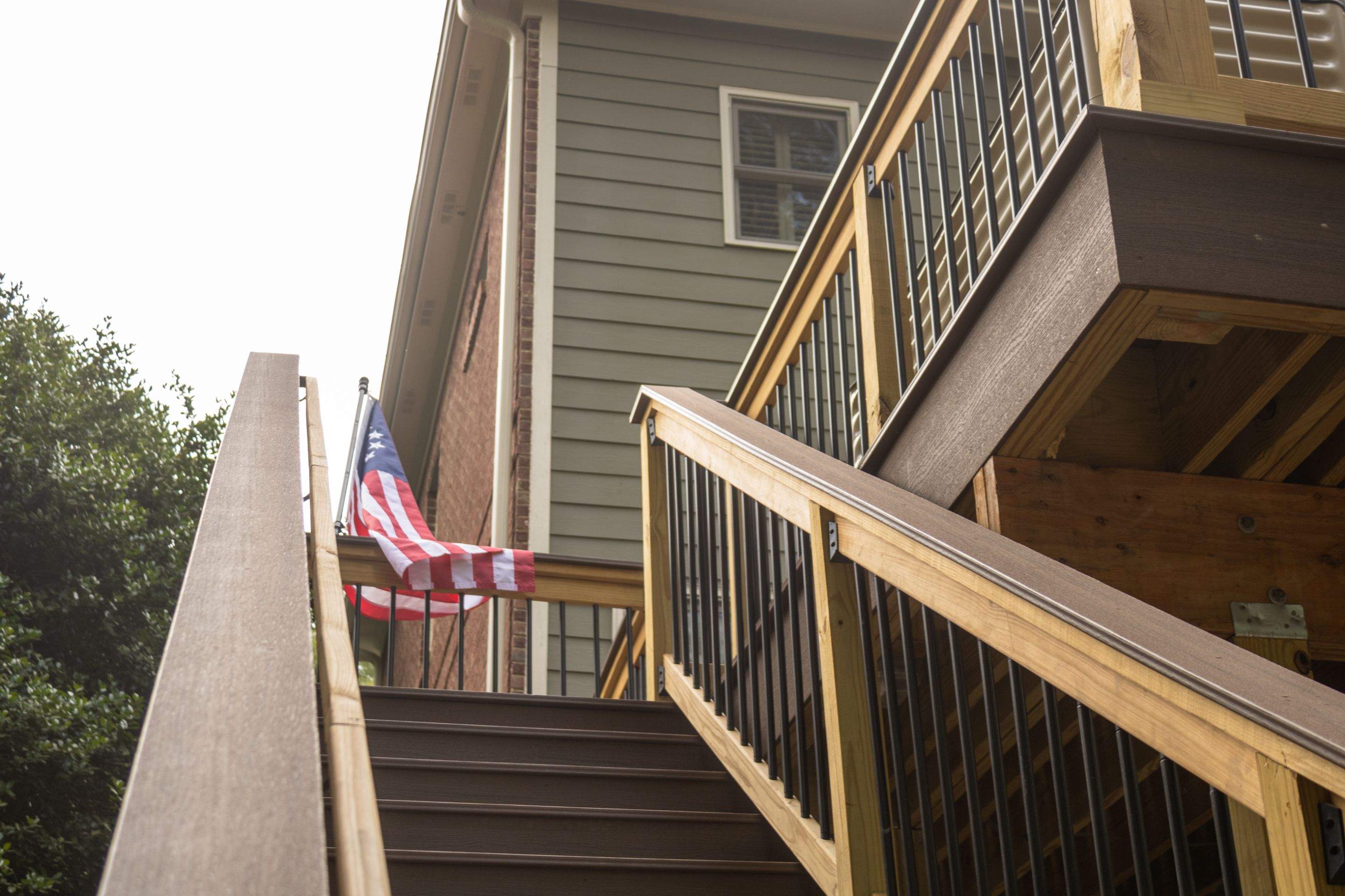 Tucker, GA Covered Porch Build and Deck Replacement using Deckorators Voyage Series Decking by Nelson Exteriors 