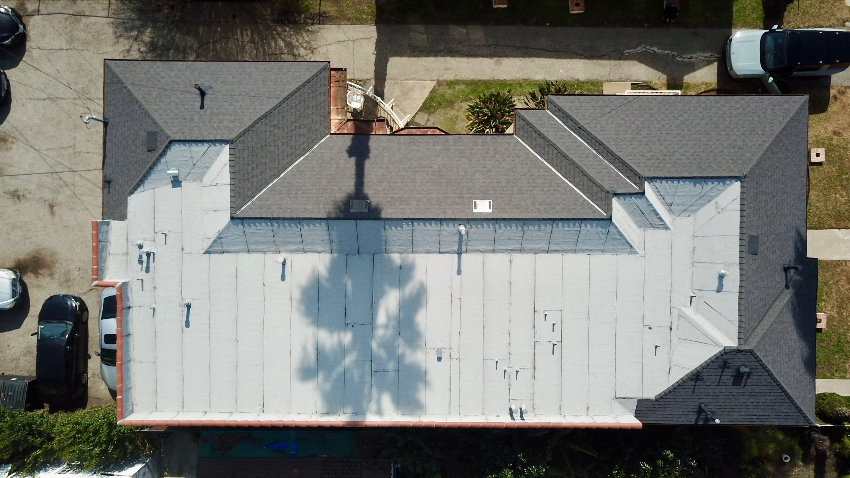 Apartment Building Roofing Installation using CertainTeed GTA Modified Bitument System by Hull Brothers Roofing