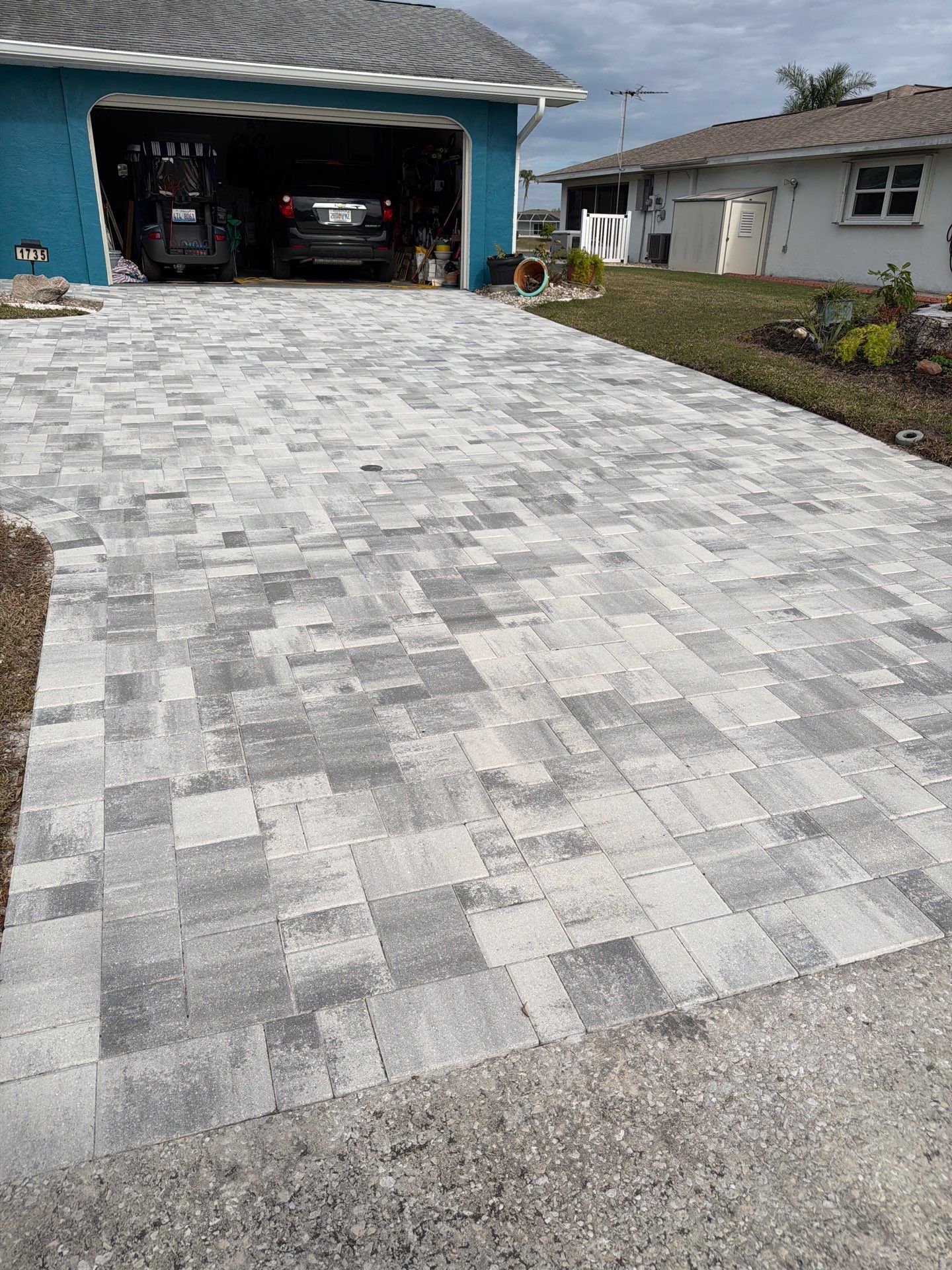 Modern Gray Paver Driveway and Entryway Walkway in Sun City Center by Supreme Paver Experts