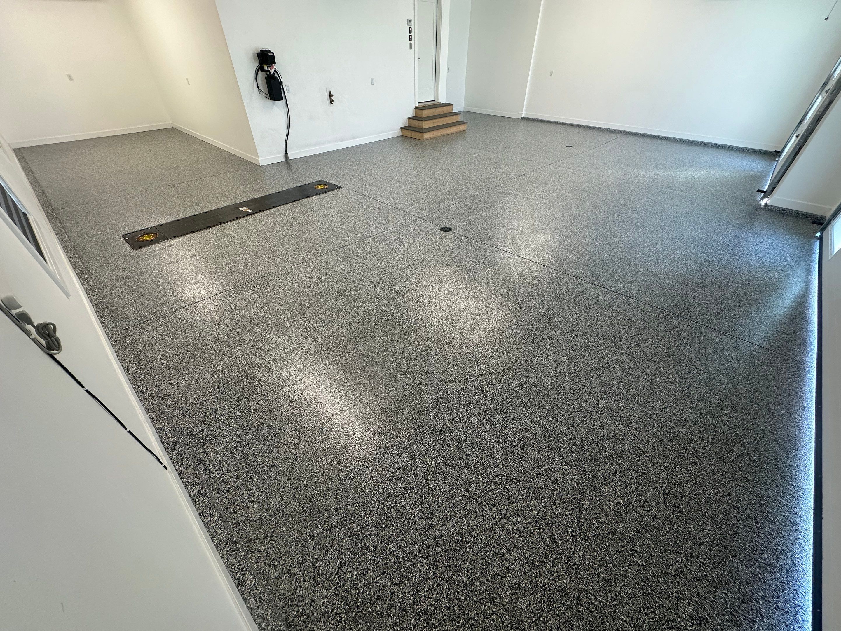 Multi-Color Epoxy Flake Garage Floor Installation in Sioux Falls by Select Painting, Coatings & Garage Cabinets