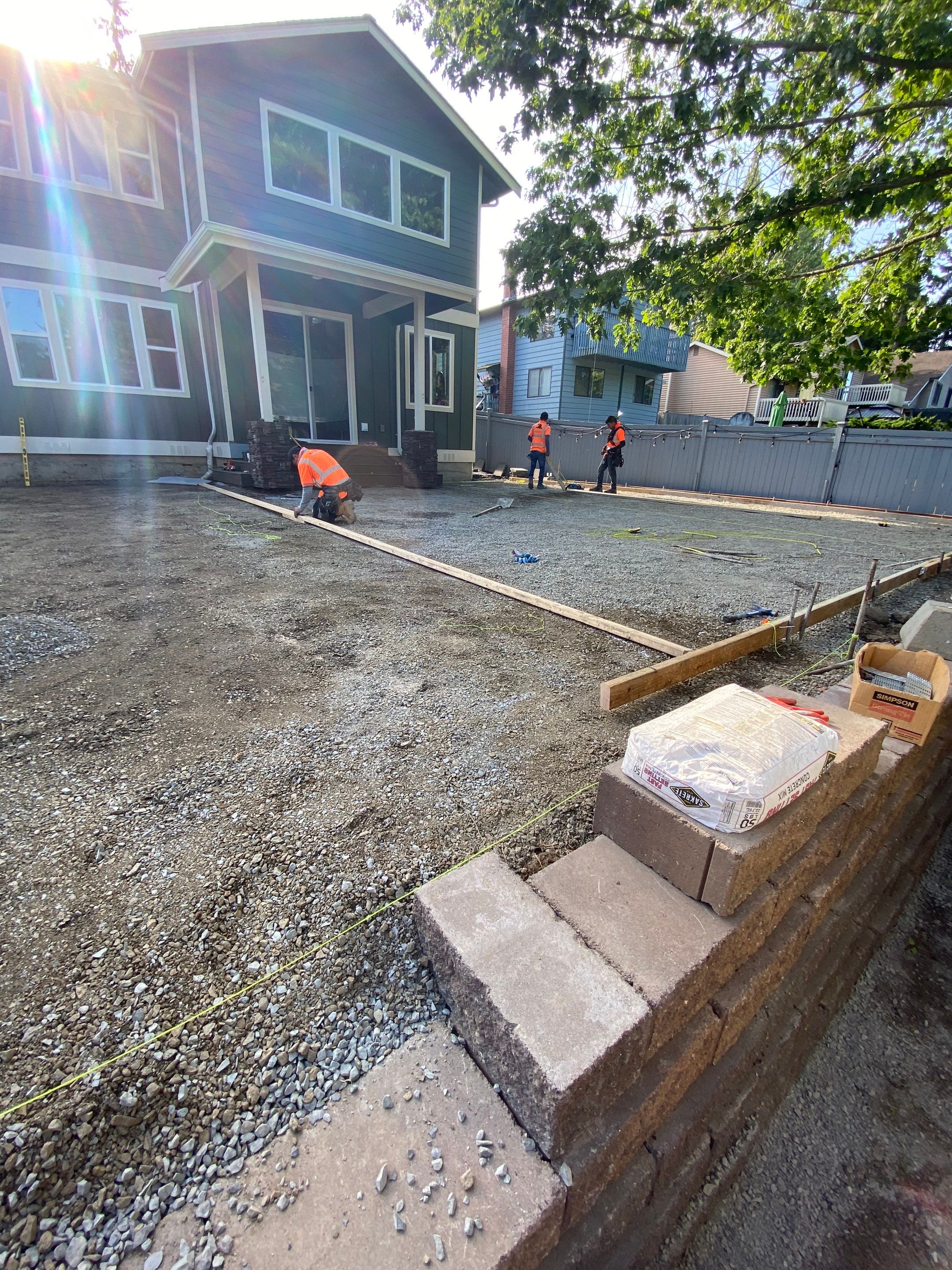 Patio Installation using Concrete, Retaining walls, and Turf install by Jireh Asphalt & Concrete Inc 