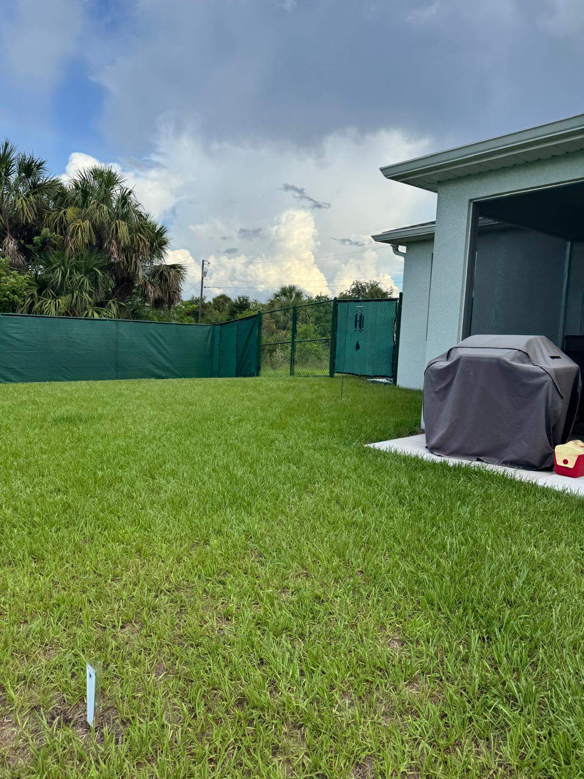 Chain Link Fence Installation with Custom Beach Privacy Screen in Port Charlotte by True Fence LLC