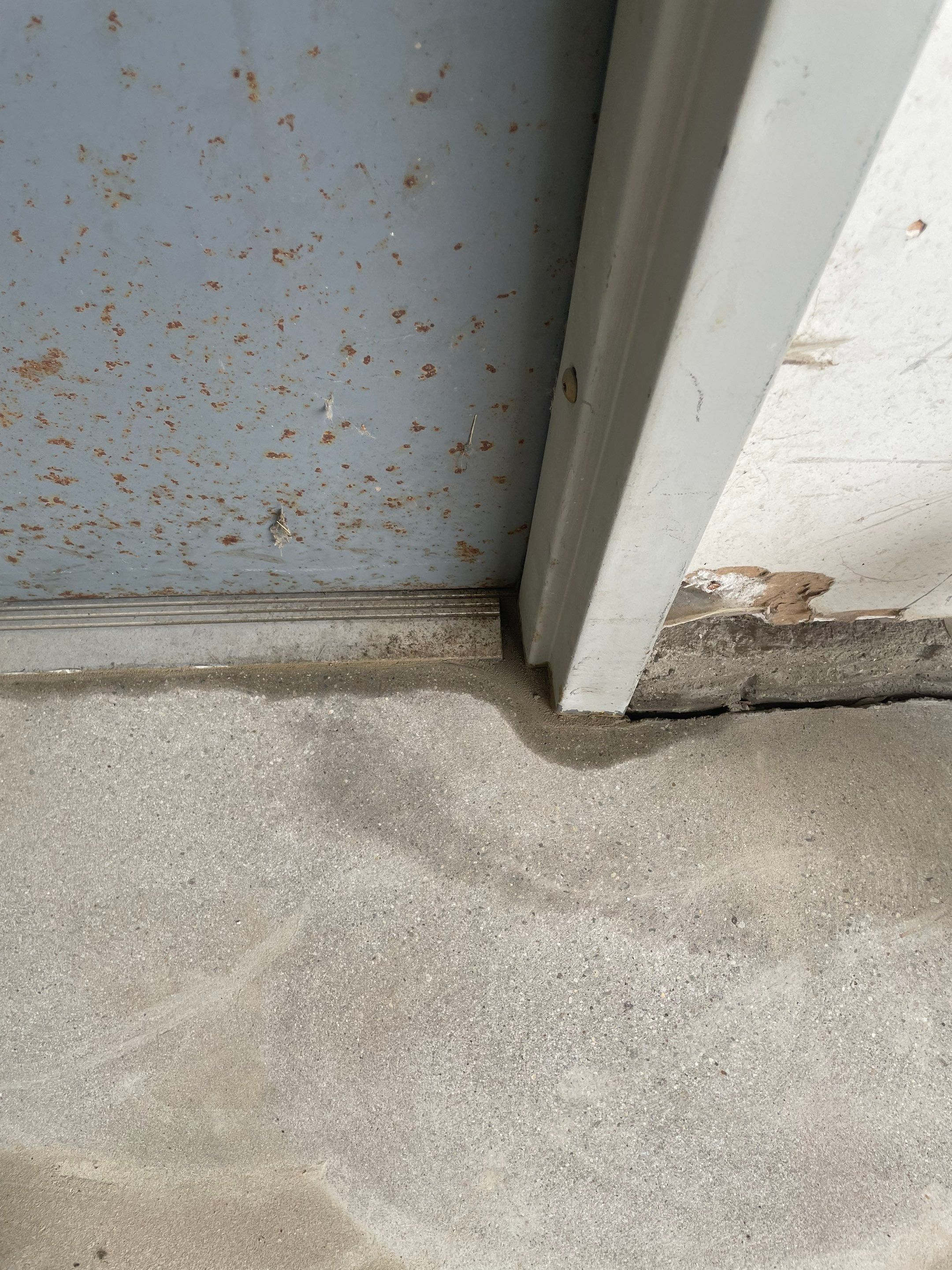 Coyote Flake Concrete Coating for Sioux Falls Garage by Select Painting, Coatings & Garage Cabinets