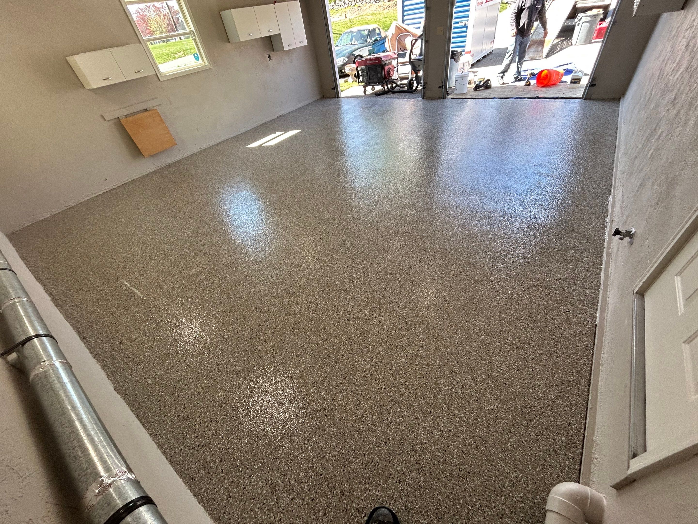 Garage Floor Transformation with Durable Concrete Floor Coating by DiGiorgi Roofing and Siding Inc