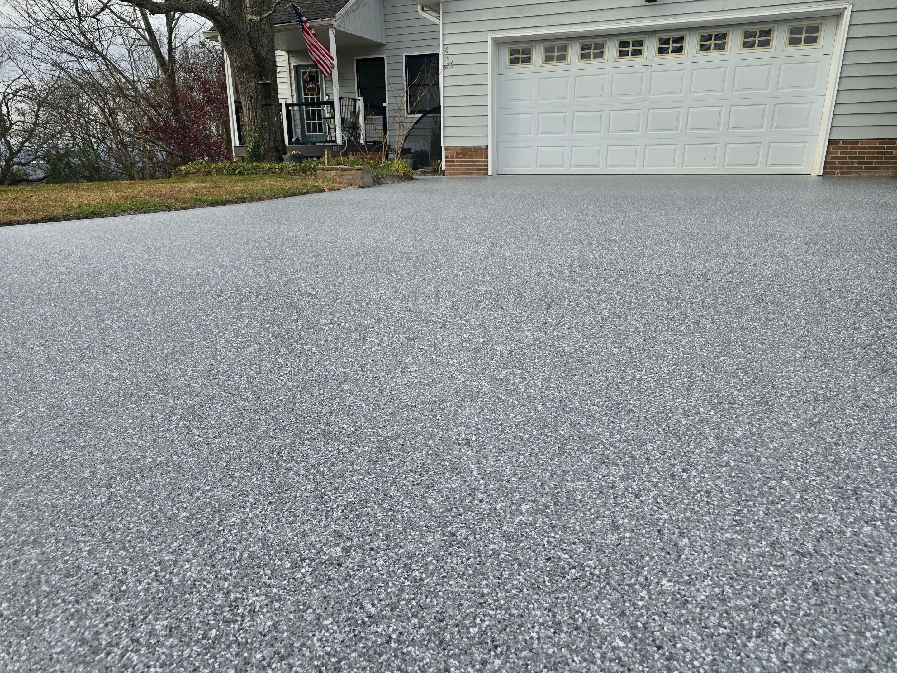 Driveway Using Weathered Gray with the Border in Nightfall by Elite Floor Solutions