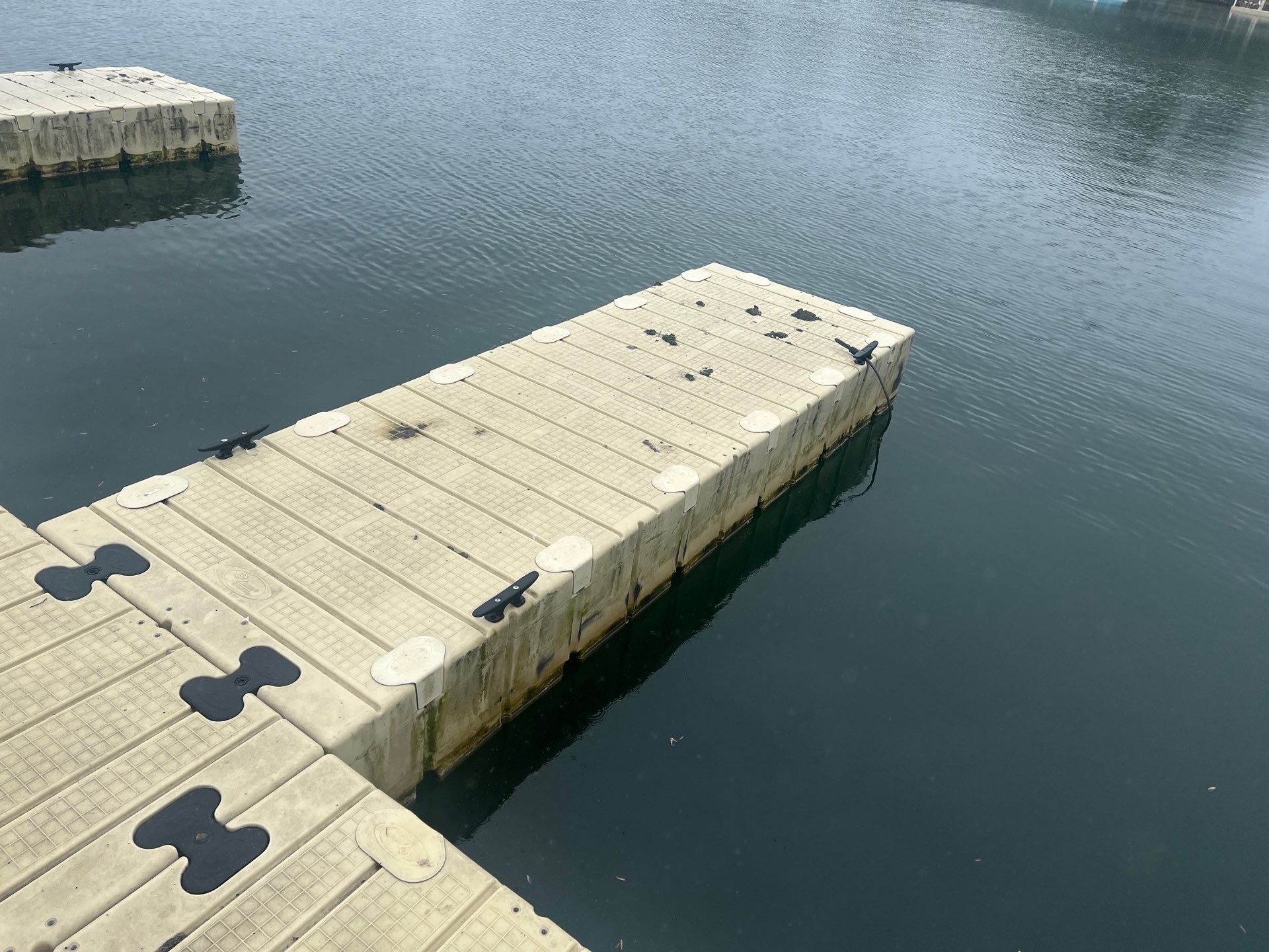 Power washing of floating dock by Northern Power Washing LLC.