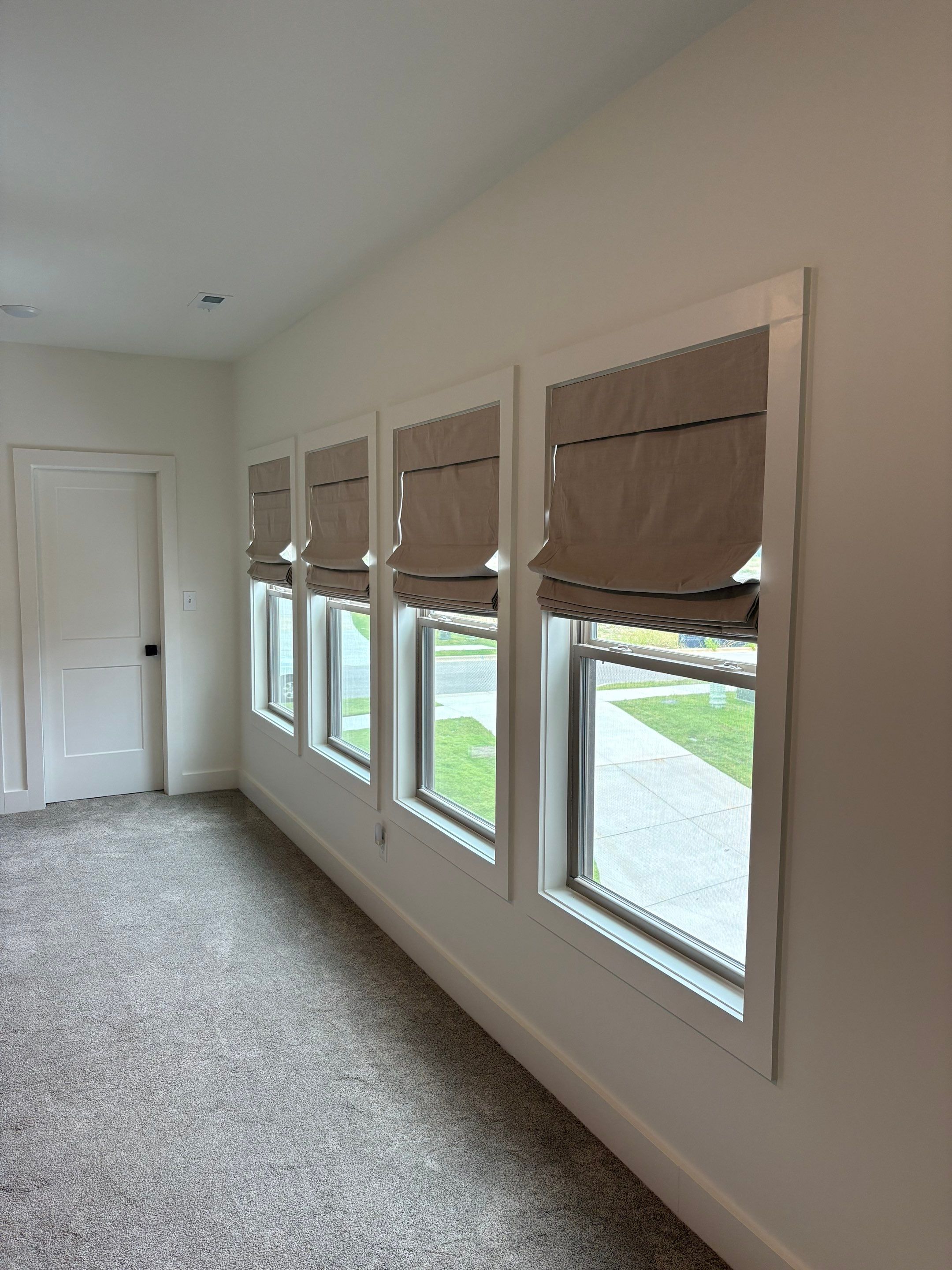 Roman and Woven Wood Shades Project in Huntsville by Blinds and Borders