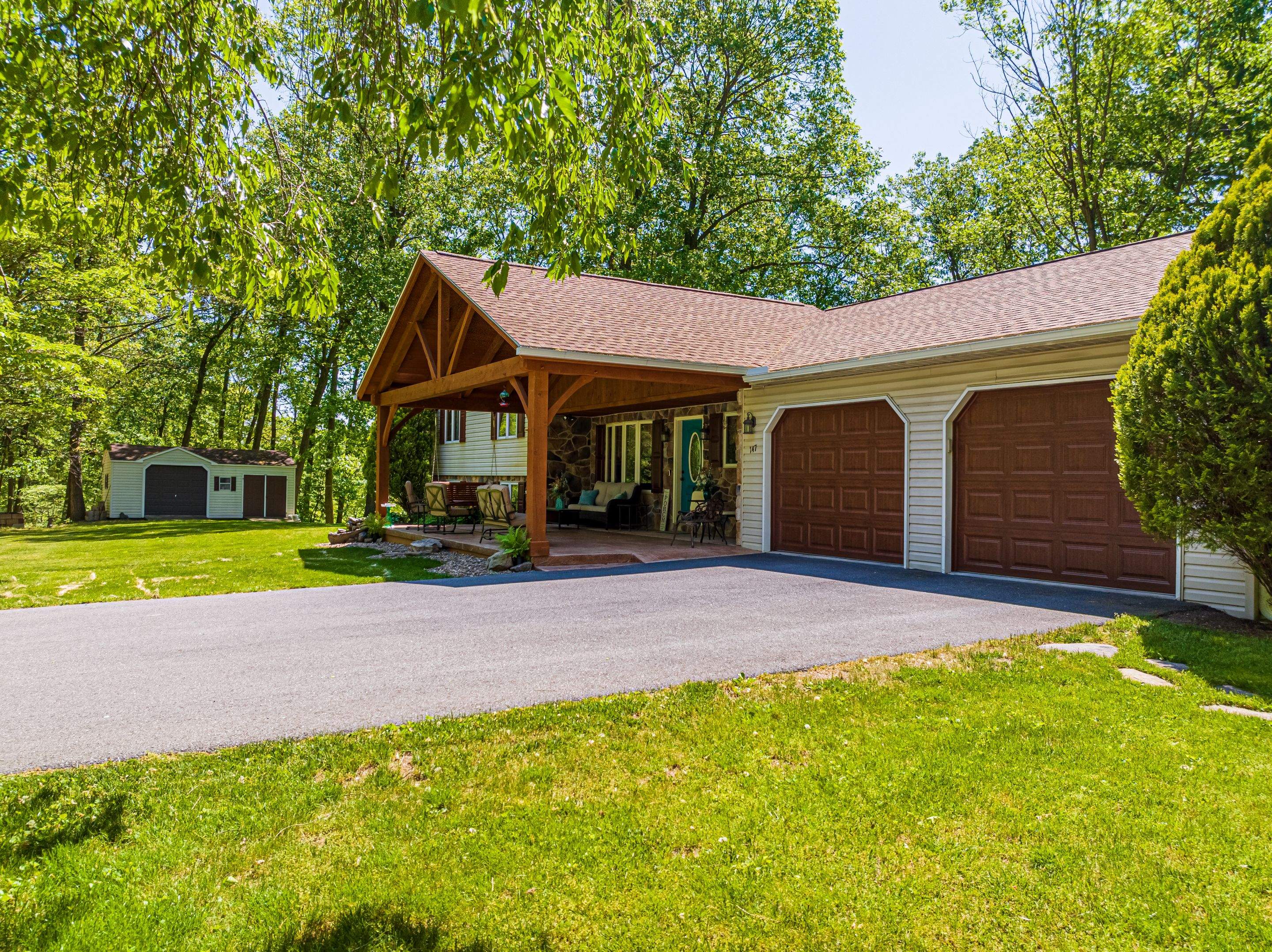 Reshingle-shakewood and timberframe patio roof by Esh Builders