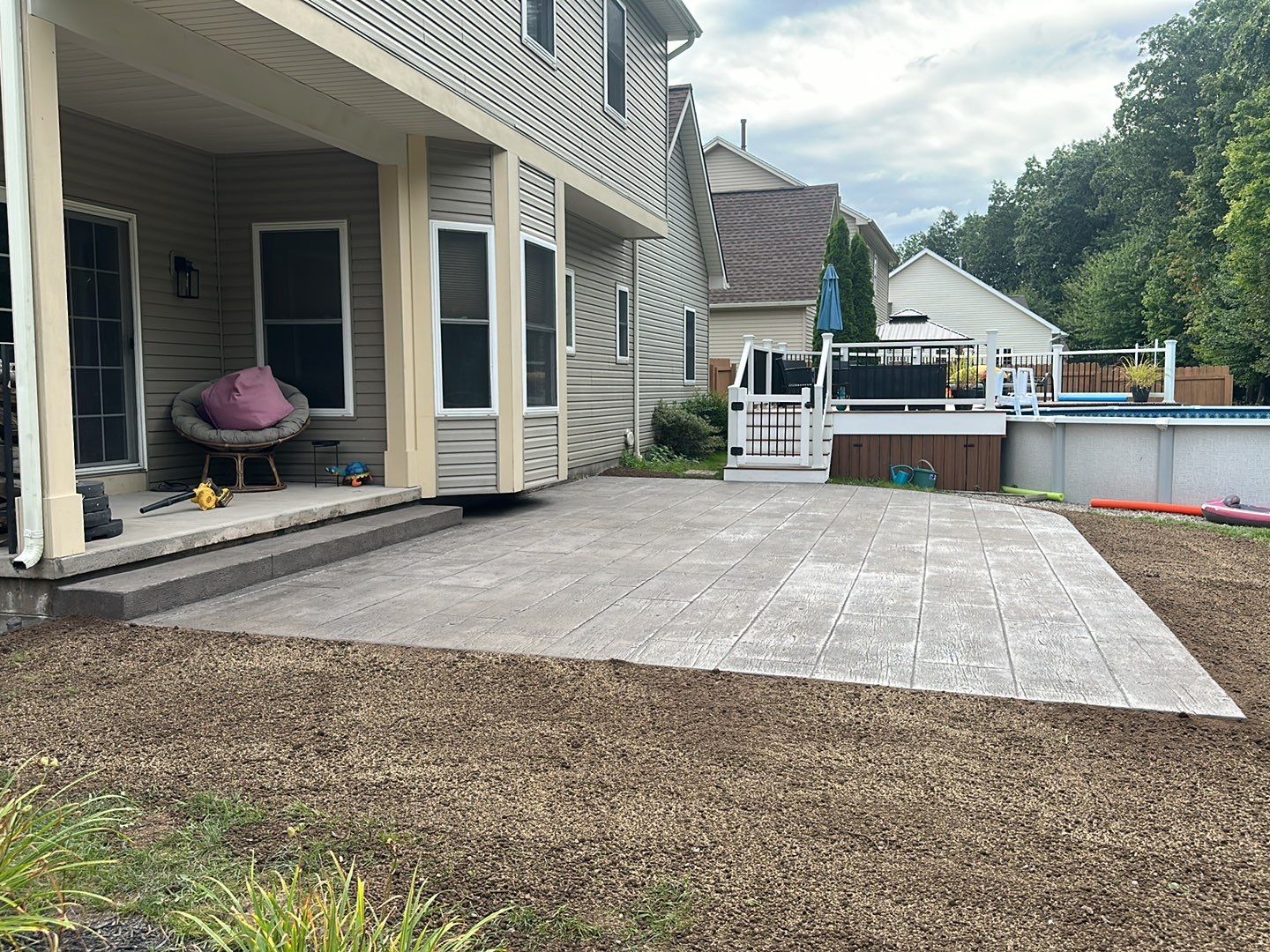 Wood Plank Stamped Concrete Patio  by NG Masonry & Construction LLC