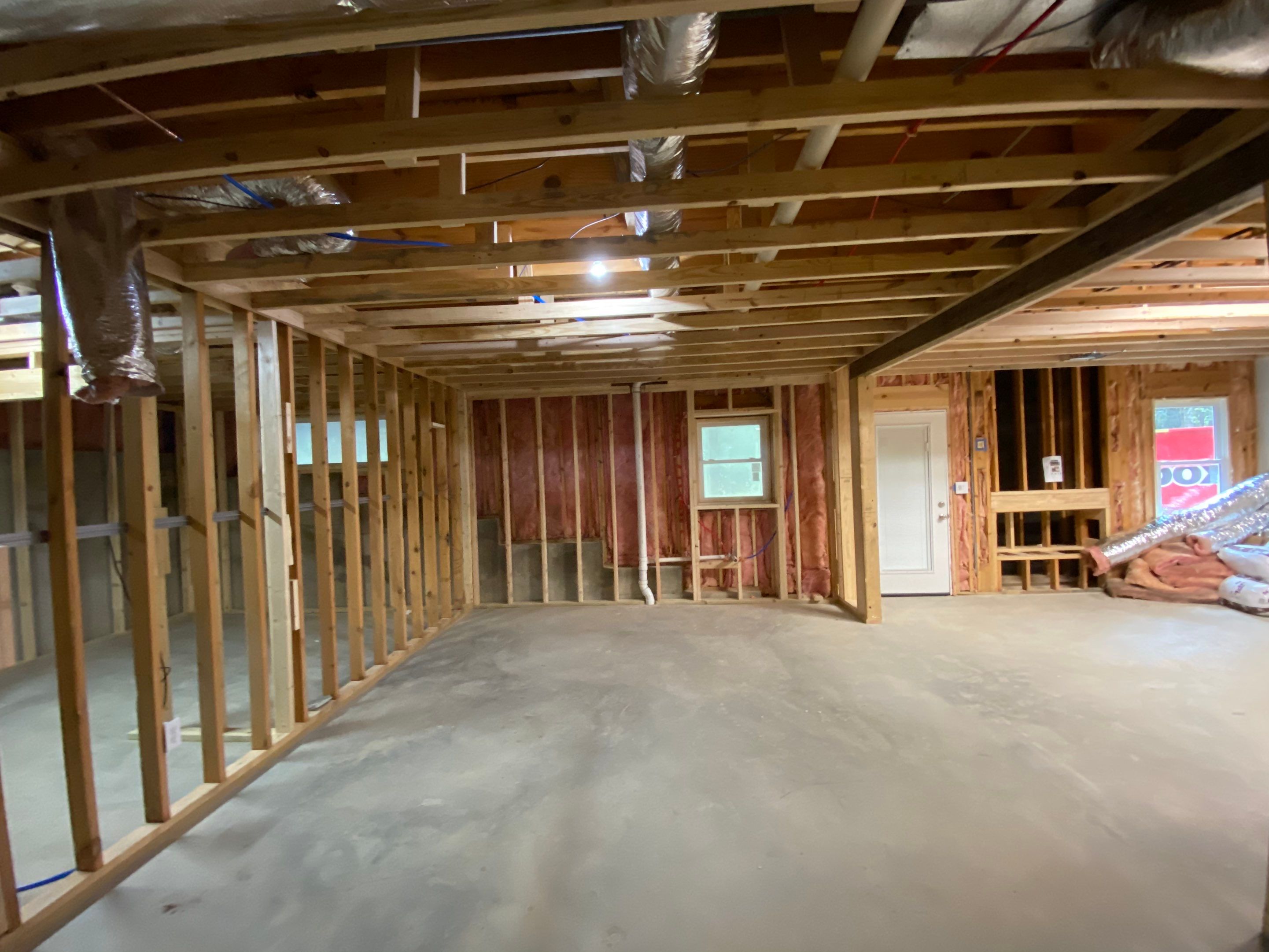 Acworth Basement Transformation With Wet Bar and Stone Fireplace by Swift Home Renovations