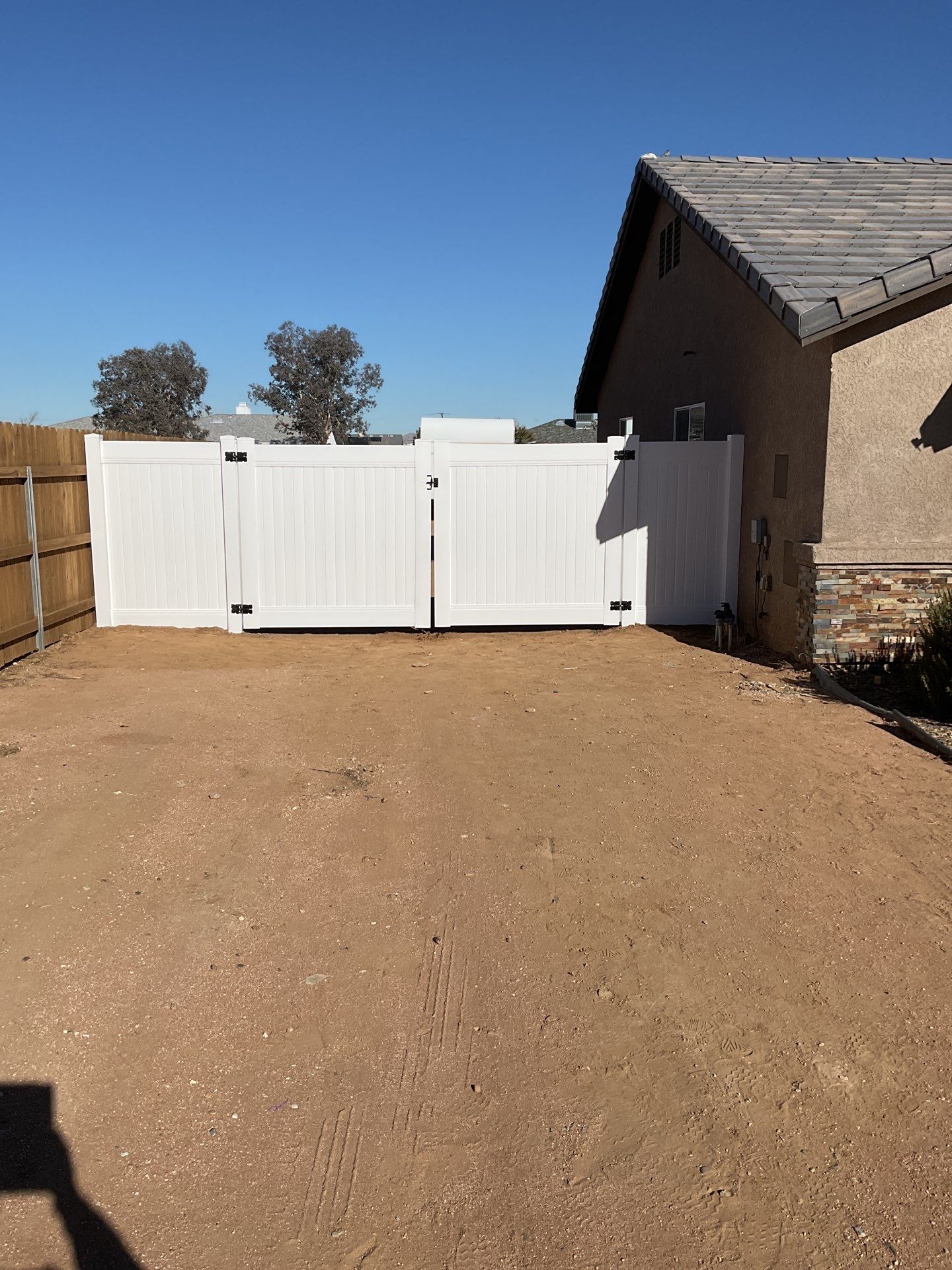 Gate installation using Vinyl by Fence Guys Inc. 