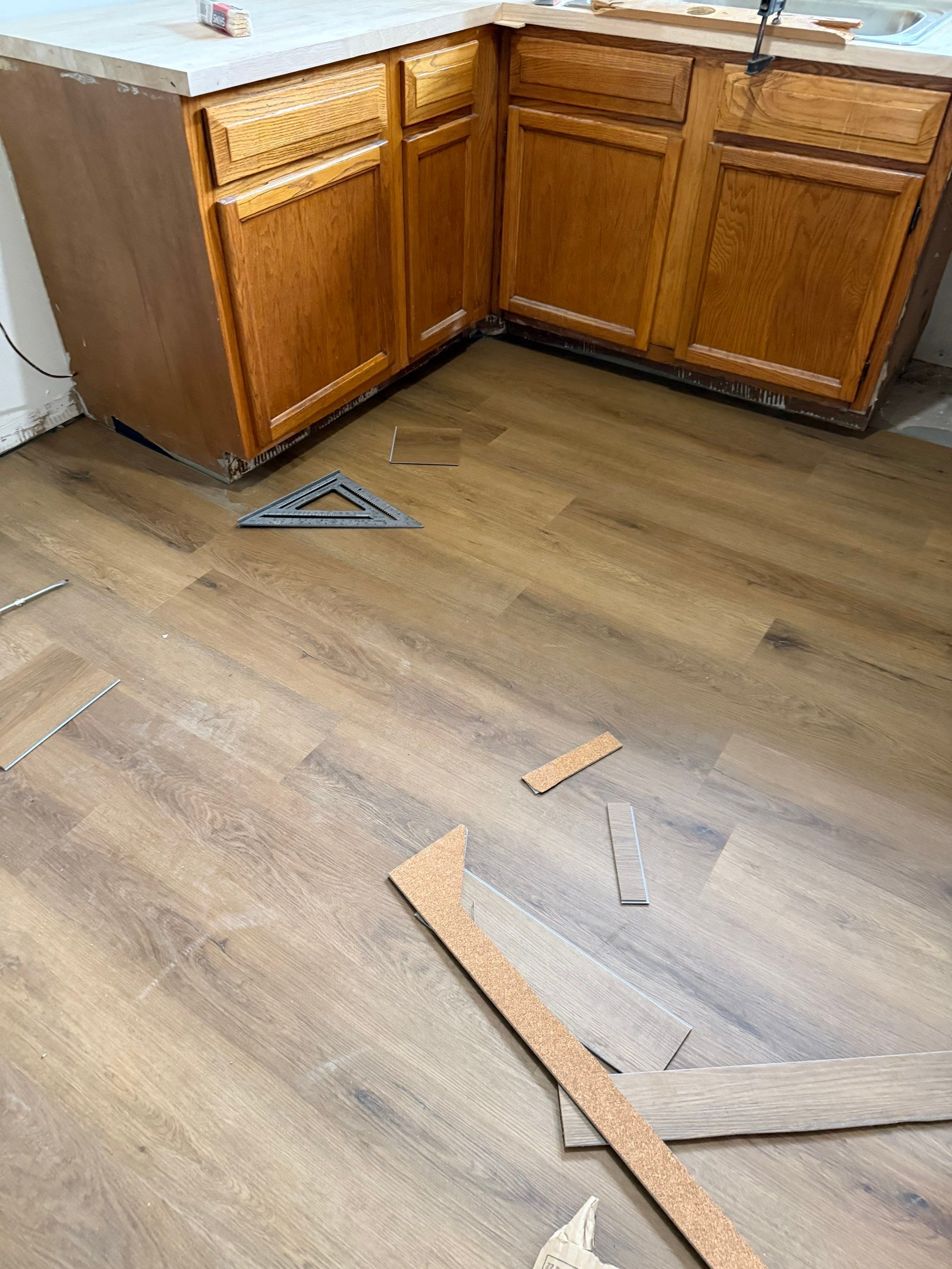 Complete Home Remodel Featuring Custom Kitchen and Wood-Look Plank Flooring by MAJO