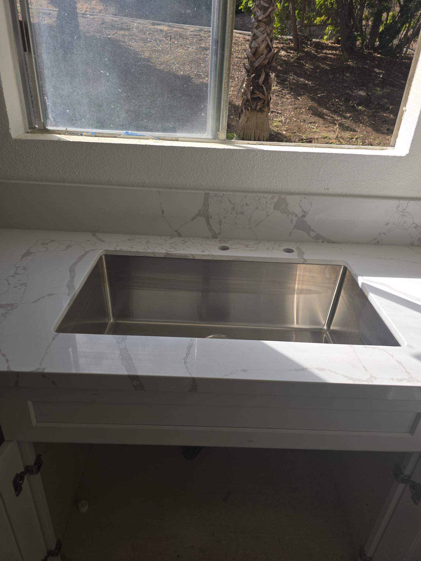 Scope of Work: Installation of Shower, Toilet, Plumbing, Kitchen Sink, and Fixtures by Us Plumbing 