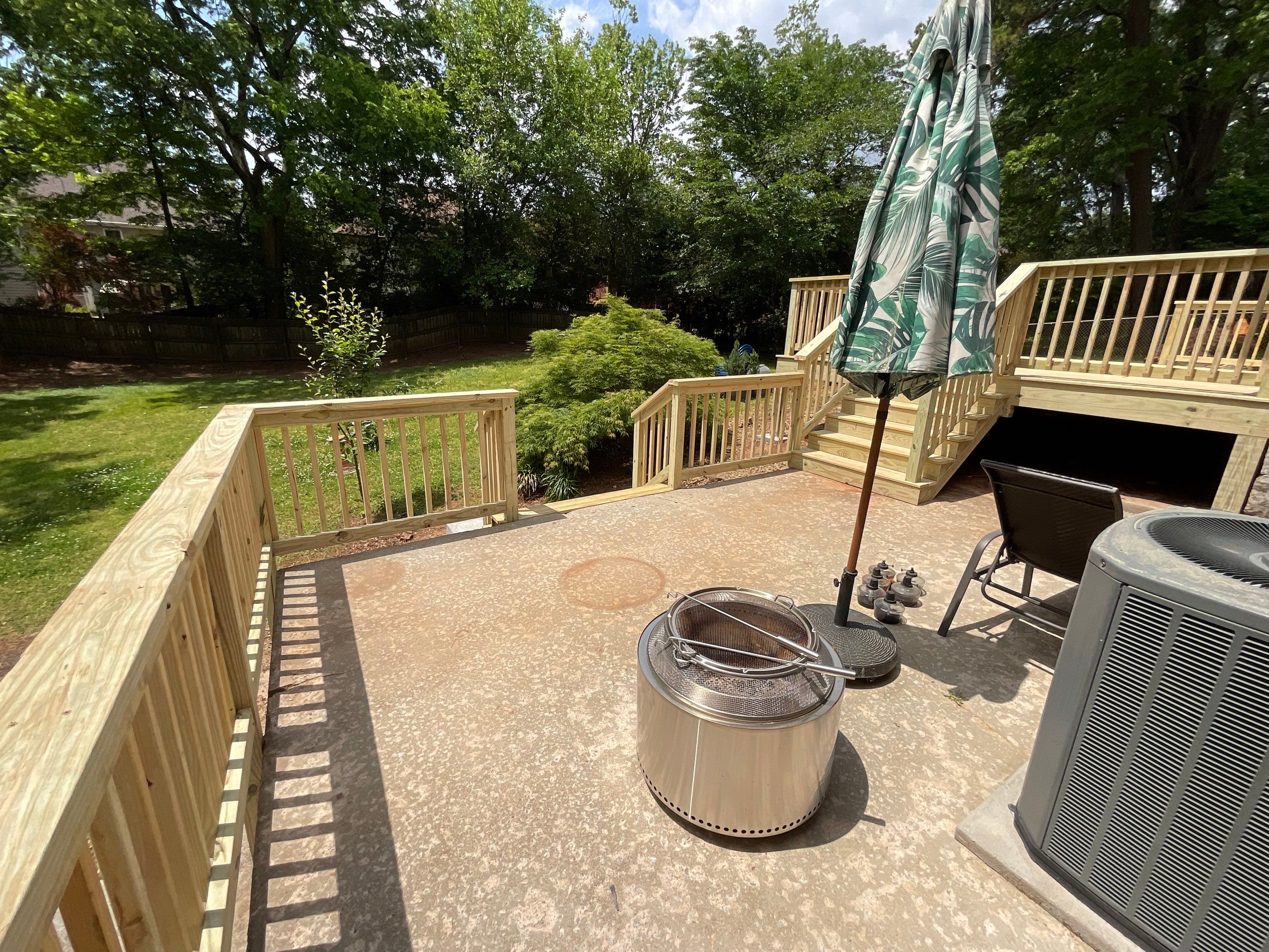 Custom Pressure-Treated Wood Deck and Railing Installation in Decatur by Swift Home Renovations