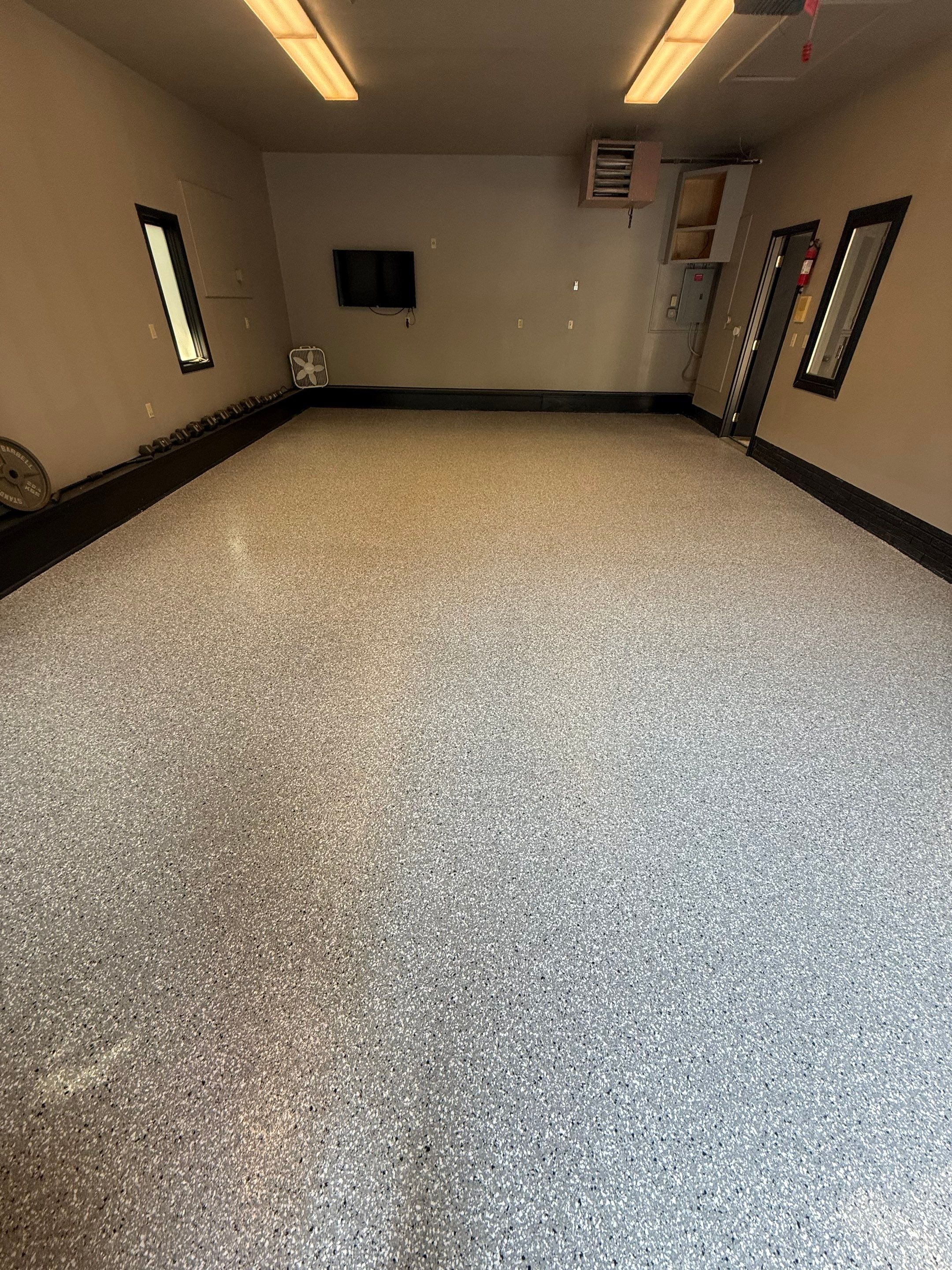 Garage Floor and Textured Pool Deck Coating in Sioux Falls by Select Painting, Coatings & Garage Cabinets