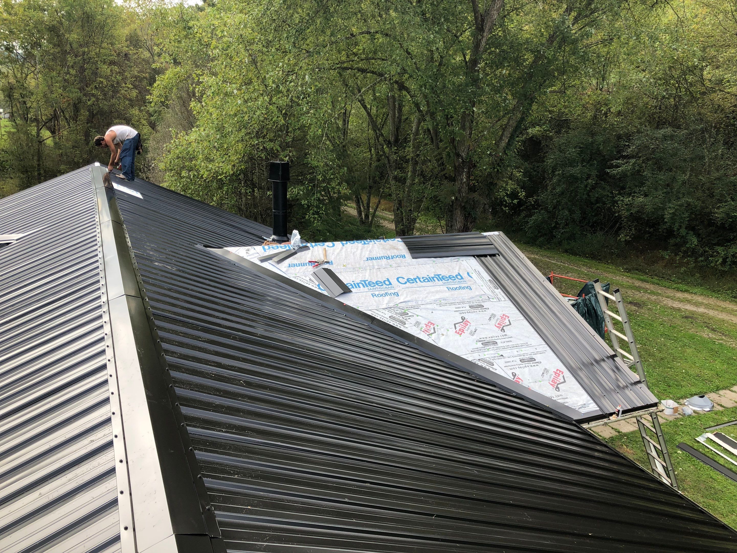 Metal Roof and Vinyl Siding, Soffit, Gutters using LifeTite Premium metal roofing  by Secure Construction Company Inc
