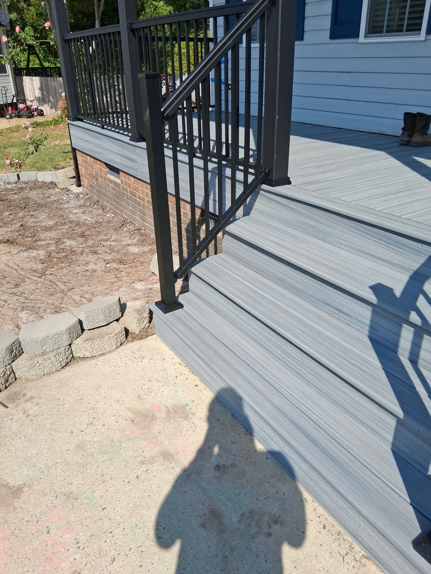 Willow Spring Composite Deck Resurface and Black Railing Upgrade by The Remodeling Company