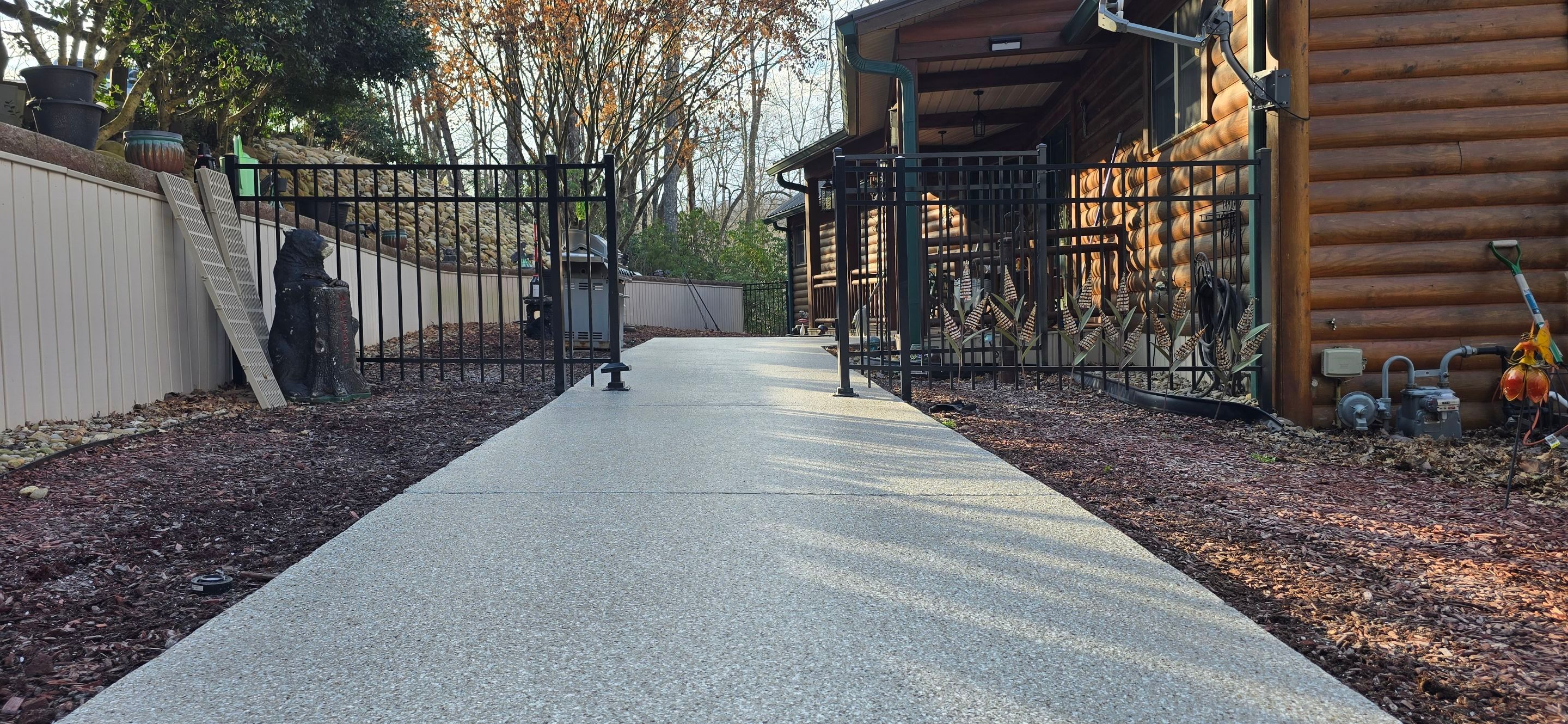 Garage & Sidewalk using Creekbed by Elite Floor Solutions
