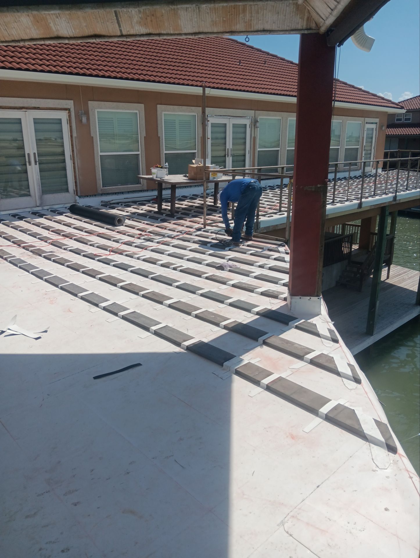 Walk Out Patio Cover by Bayfront Roofing and Construction