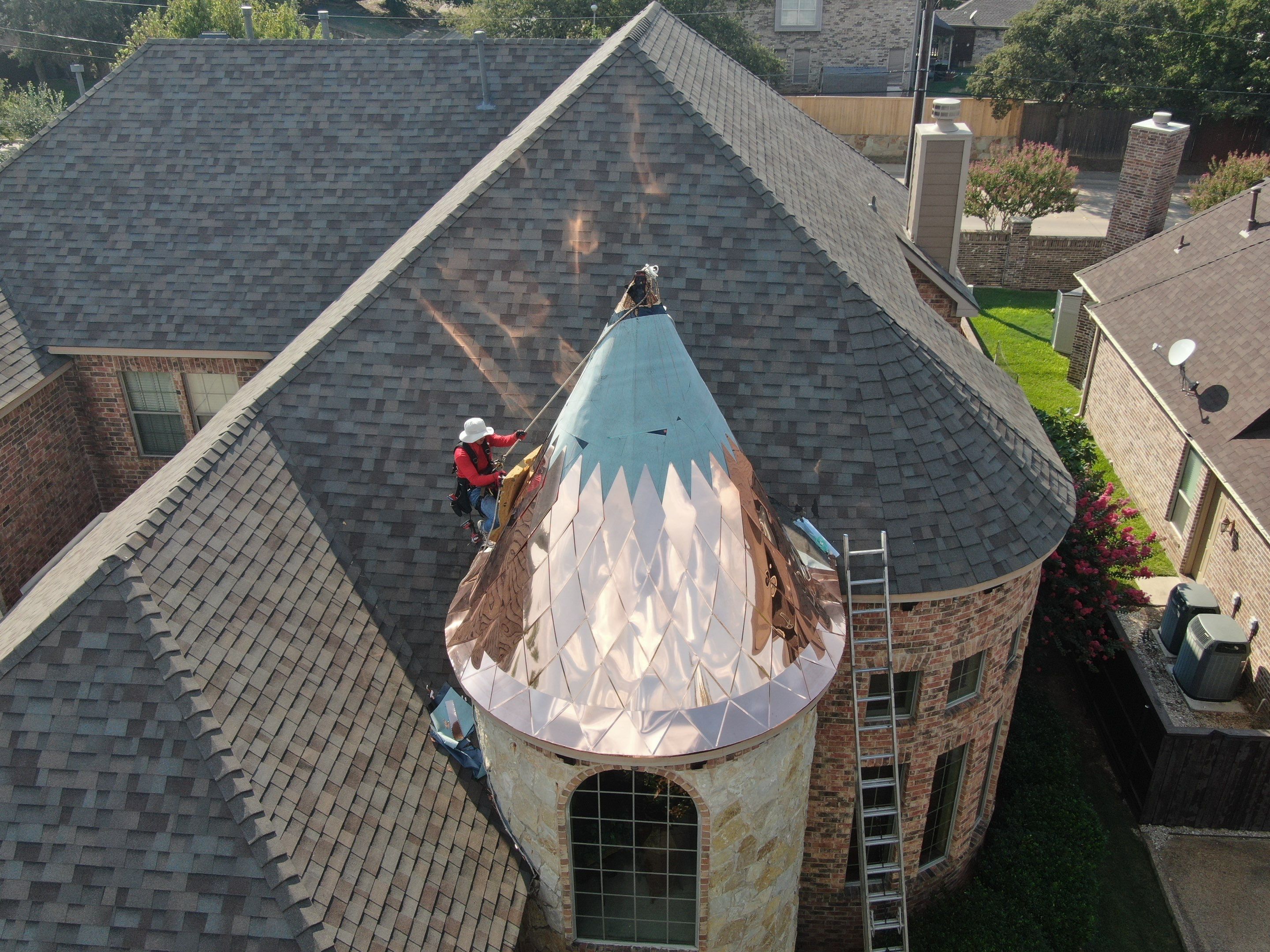 Installing Custom copper turret and Malarkey Vista Class 4 shingles Hail Damage Upgrade by Becker Roofing and Exteriors