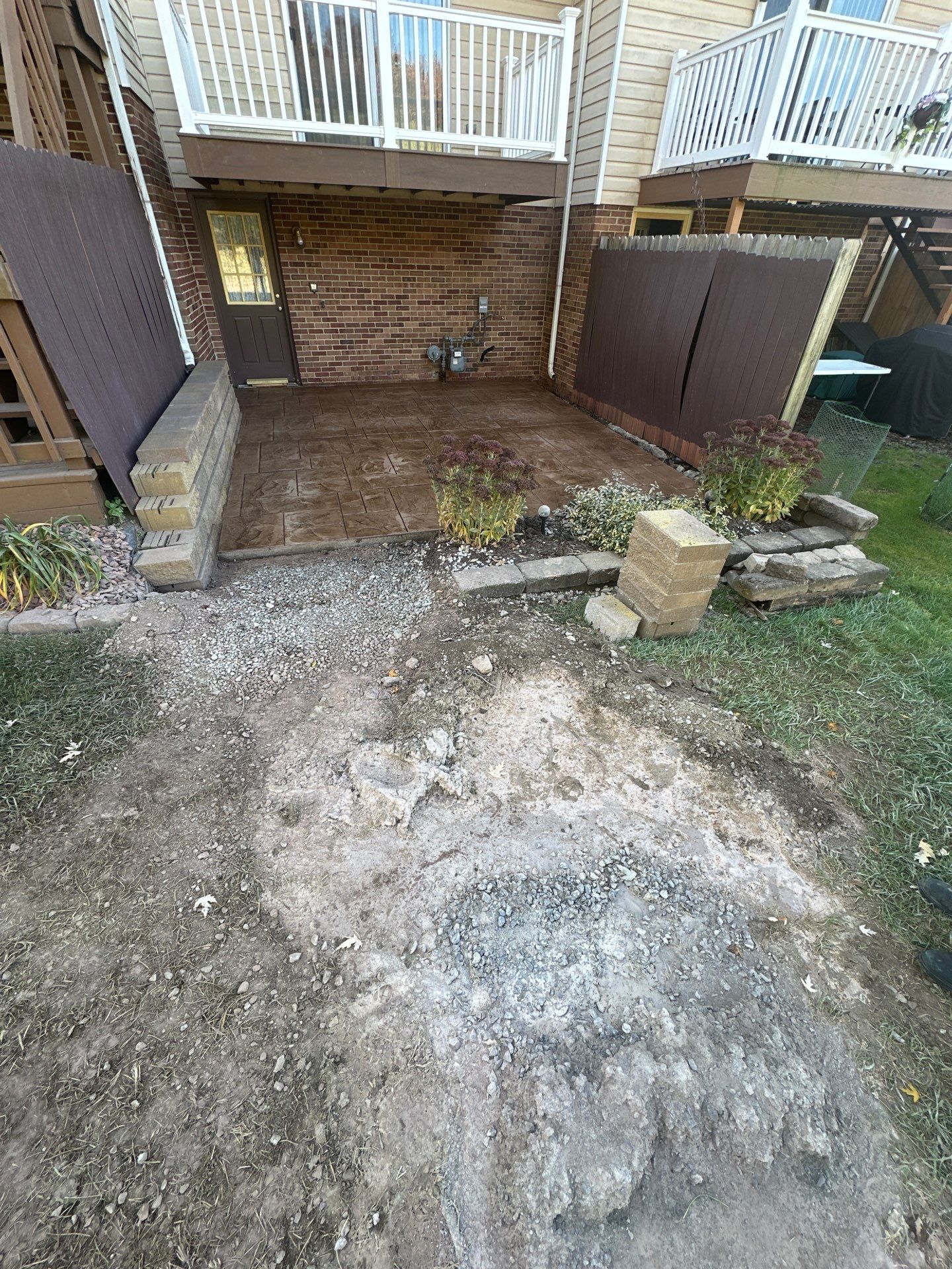 Stamped concrete and redeck  by Cousins Roofing Siding & Decks