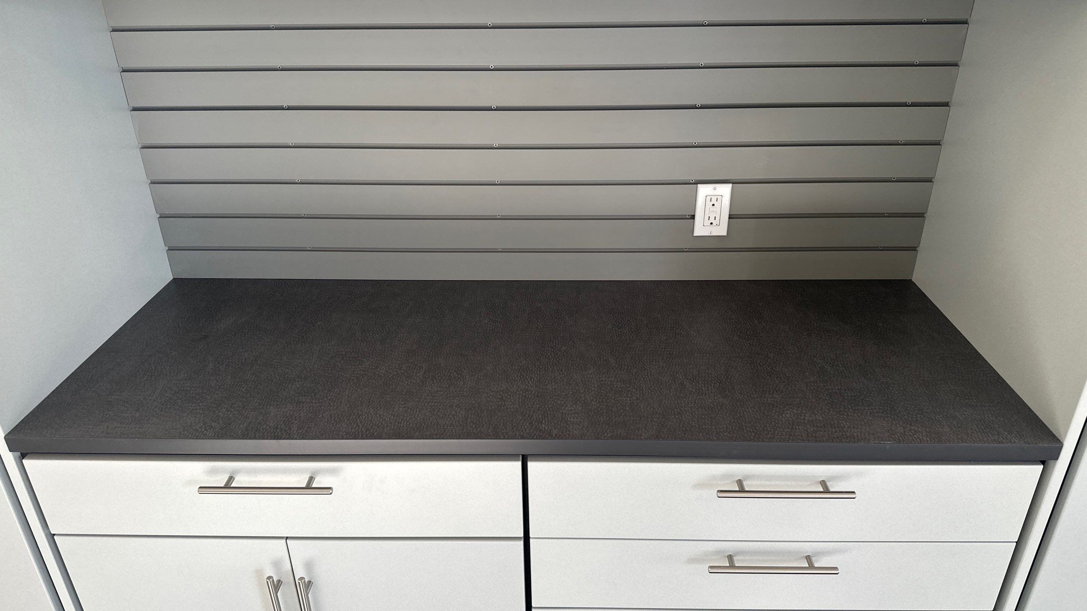 Bryon V. upgrades garage with cabinets and heavy duty slatwall by Banner Garage