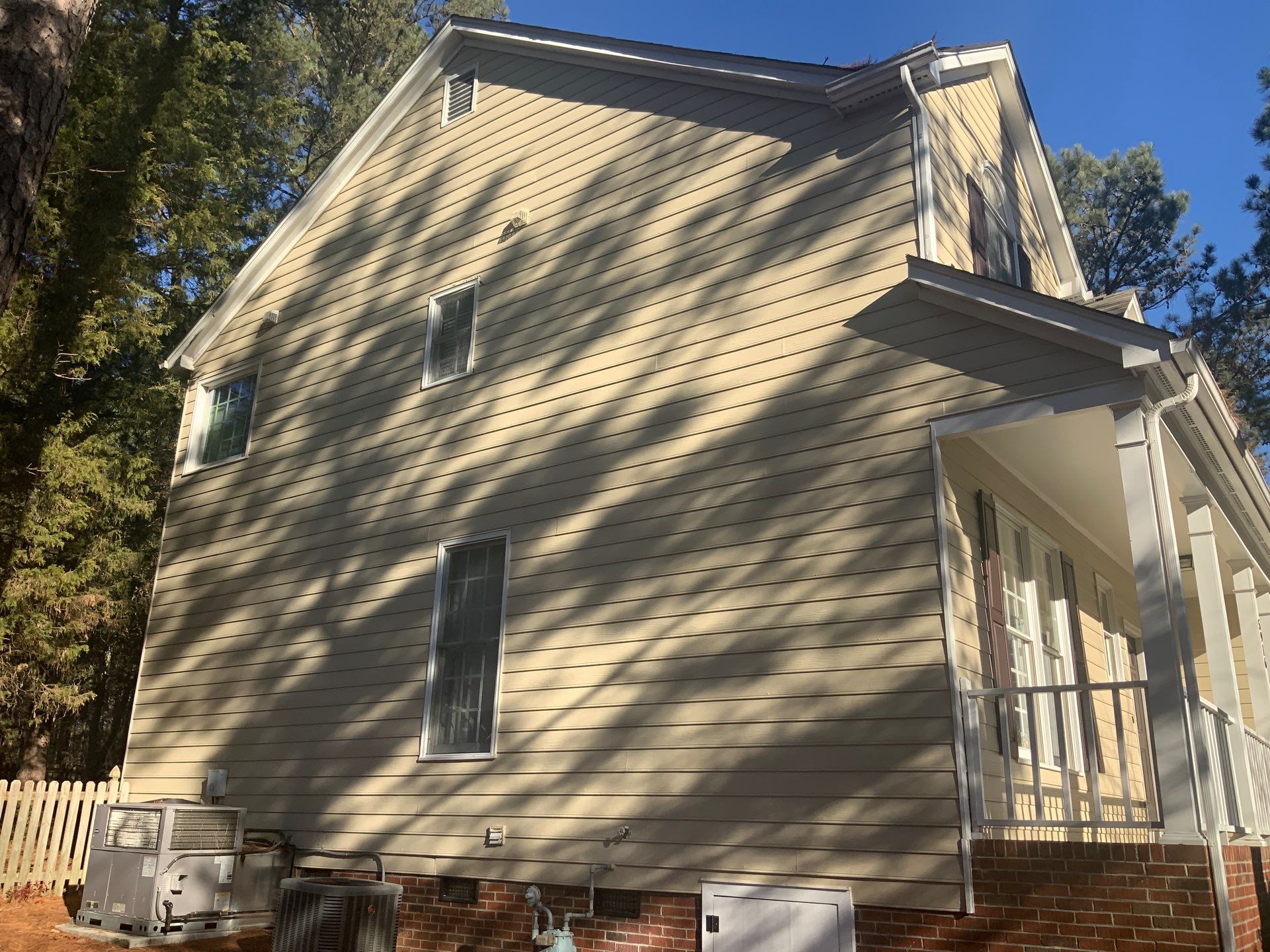 Exterior paint and siding replacement by GonzalezPainters & Contractors Inc 