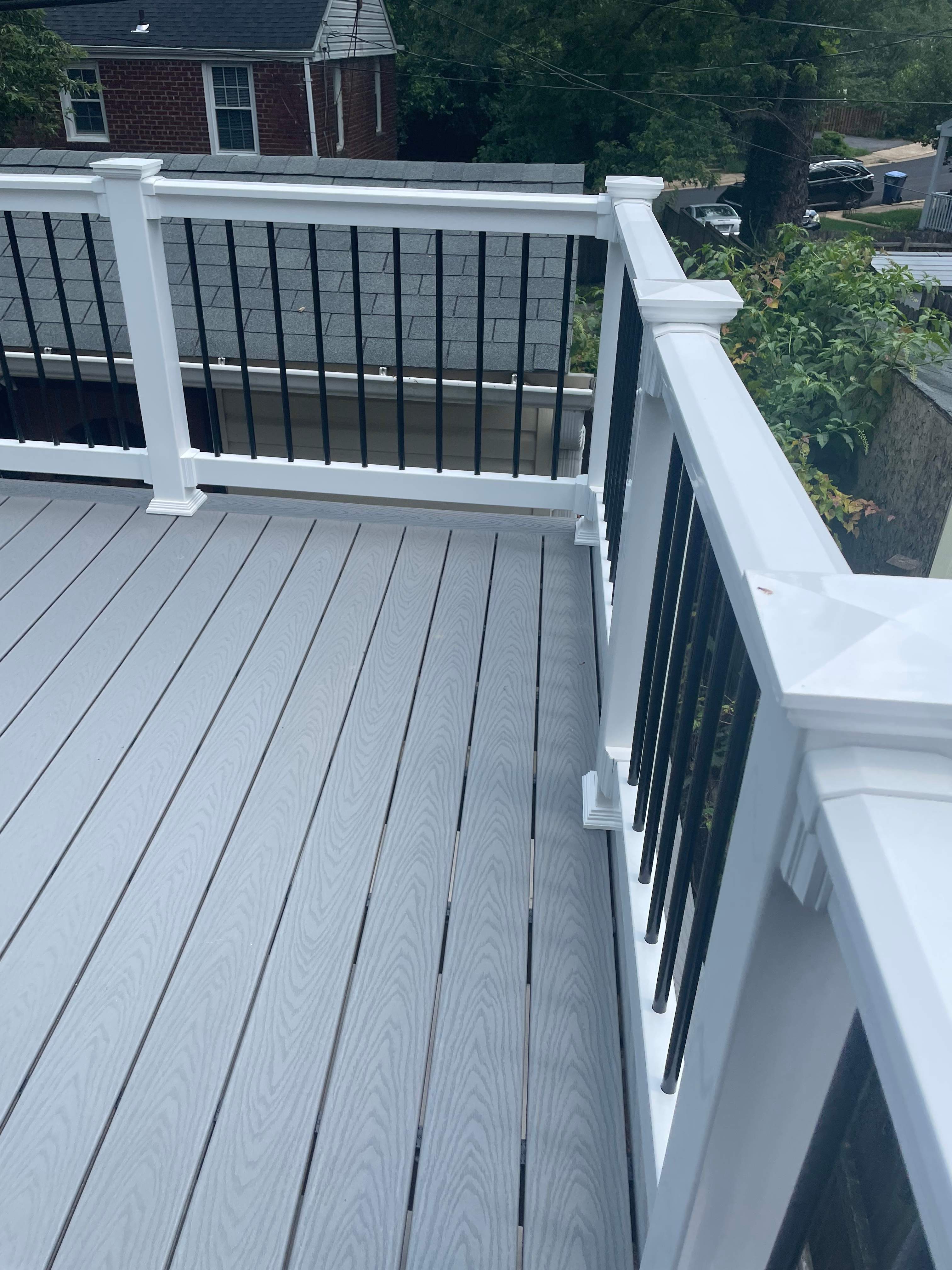 Deck resurfacing, railing replacement and concrete resurfacing by Fairfax Contractors, LLC