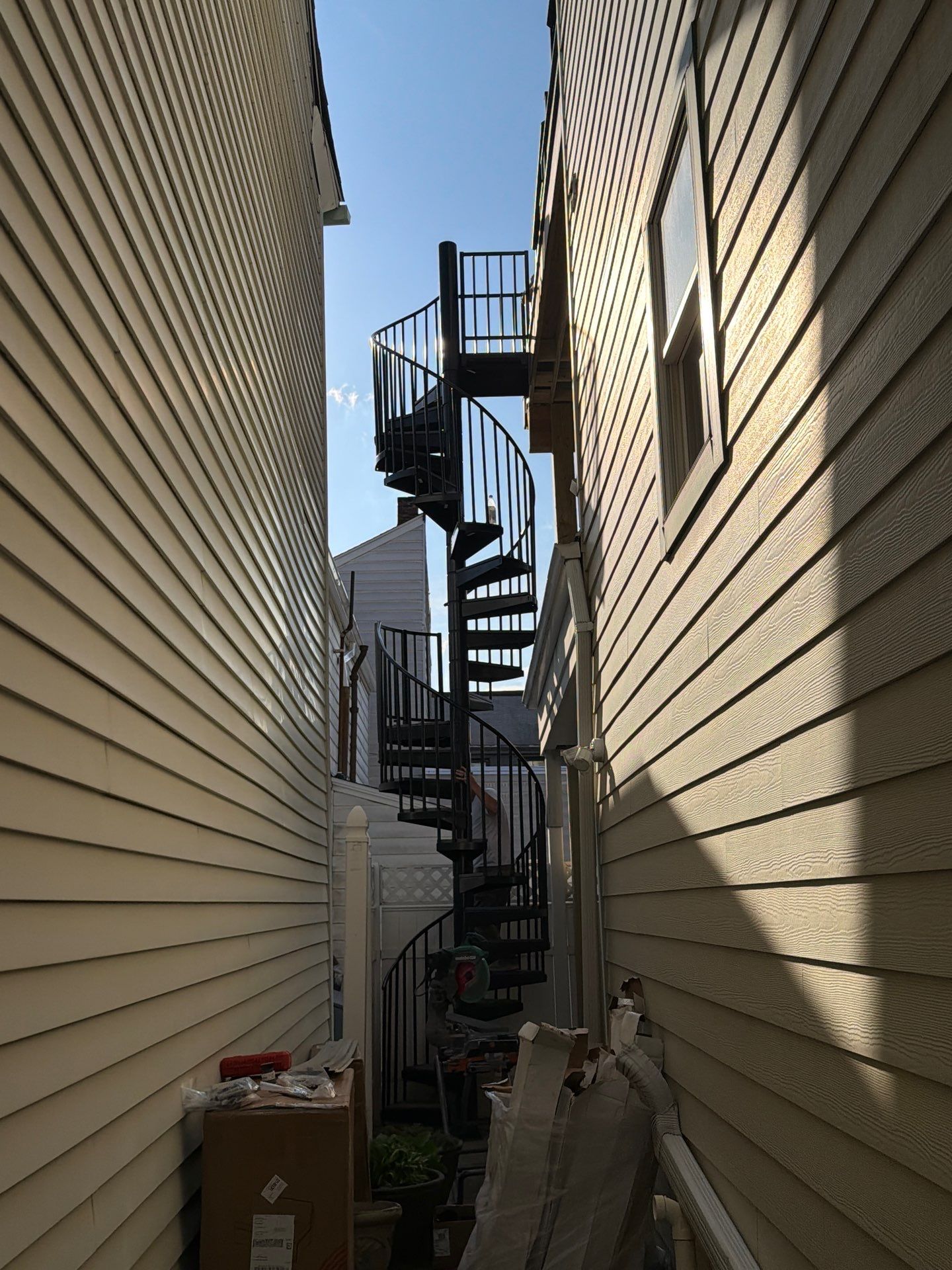 Larry Dietrich Spiral stair and deck by Cousins Roofing Siding & Decks