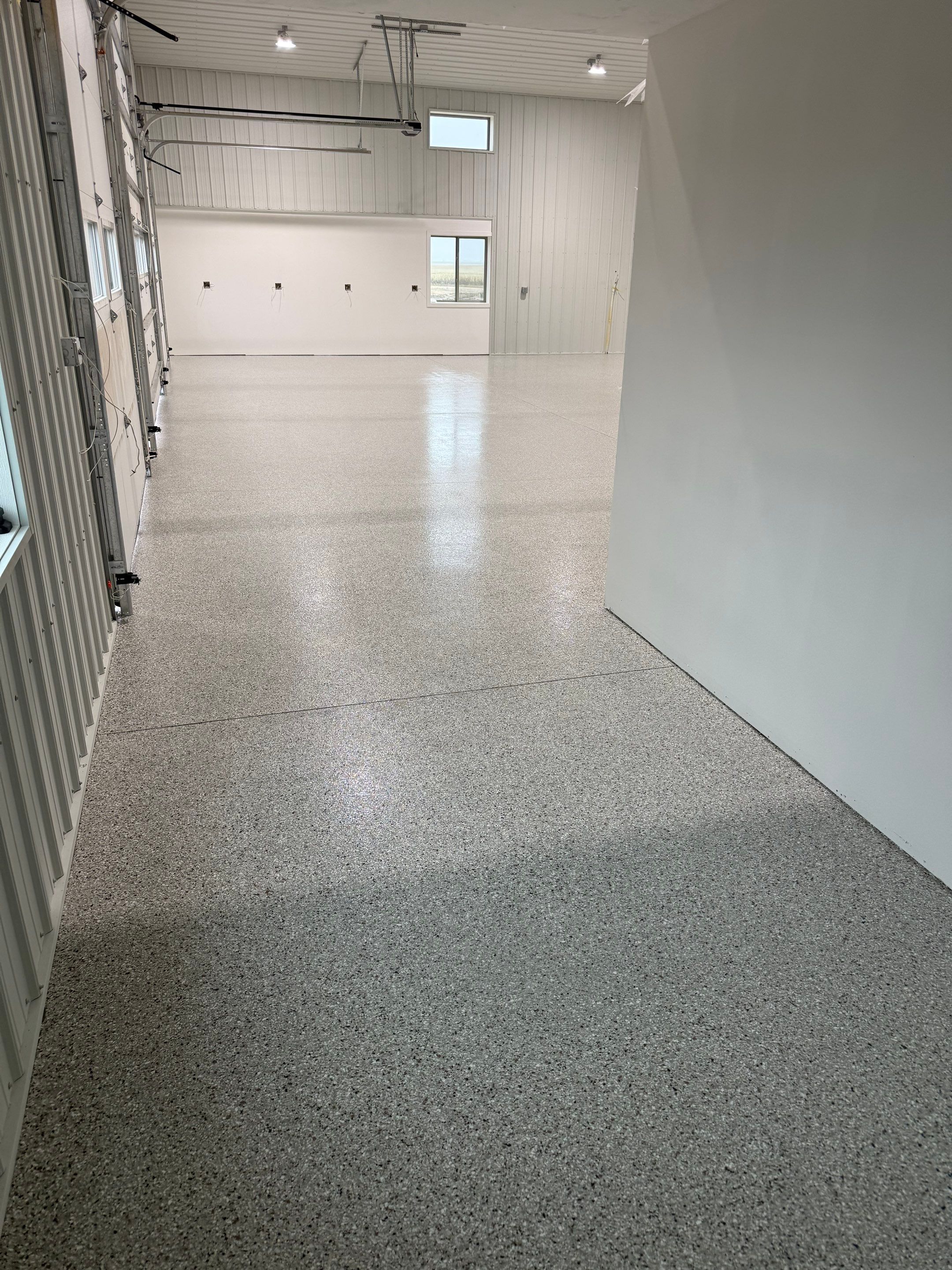 Custom Speckled Floor Coating for Large Montrose Shop by Select Painting, Coatings & Garage Cabinets