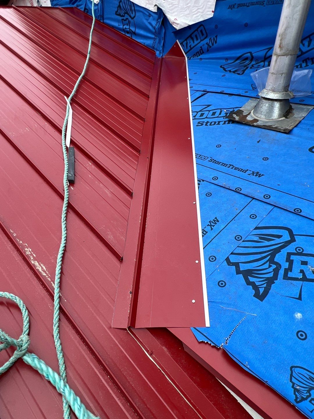 Commercial Roofing Installation using 12" Prolok metal by Top Notch Roofing Inc