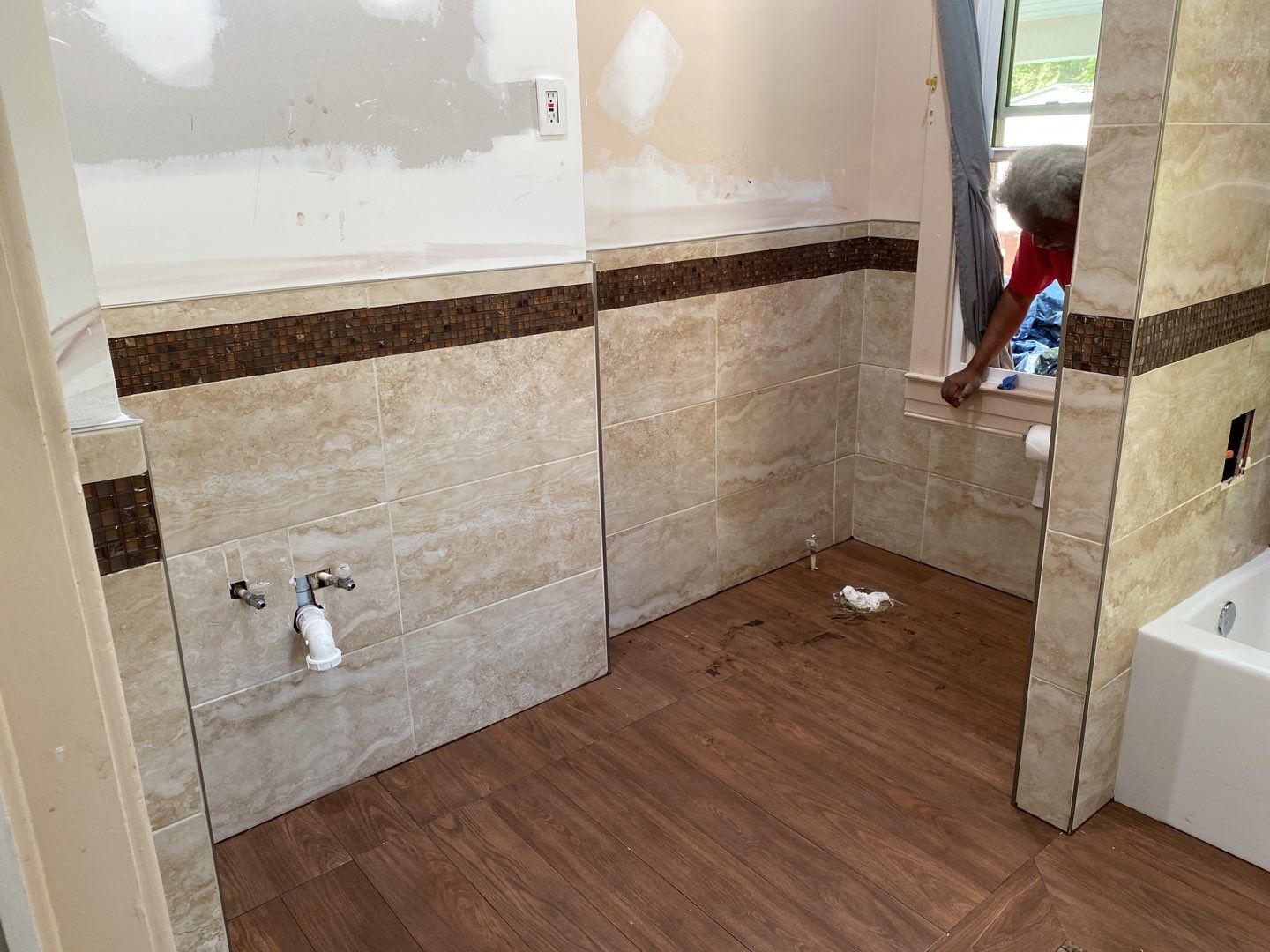 Bathroom Remodel using New Bathroom Tile and Tube by Alpha Design Services