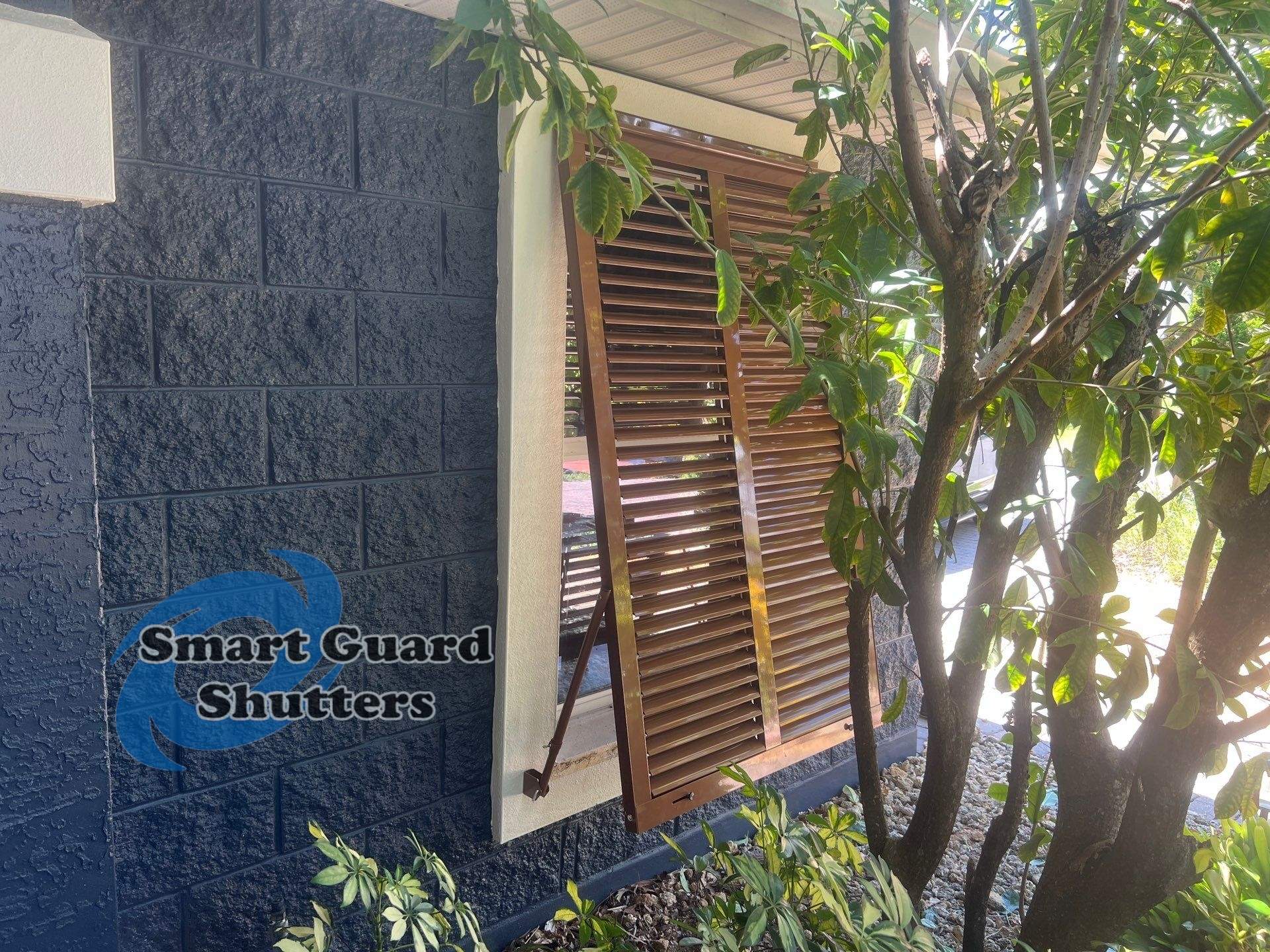 Impact Rated Bahama Shutters in Beige Brown by Smart Guard Shutters