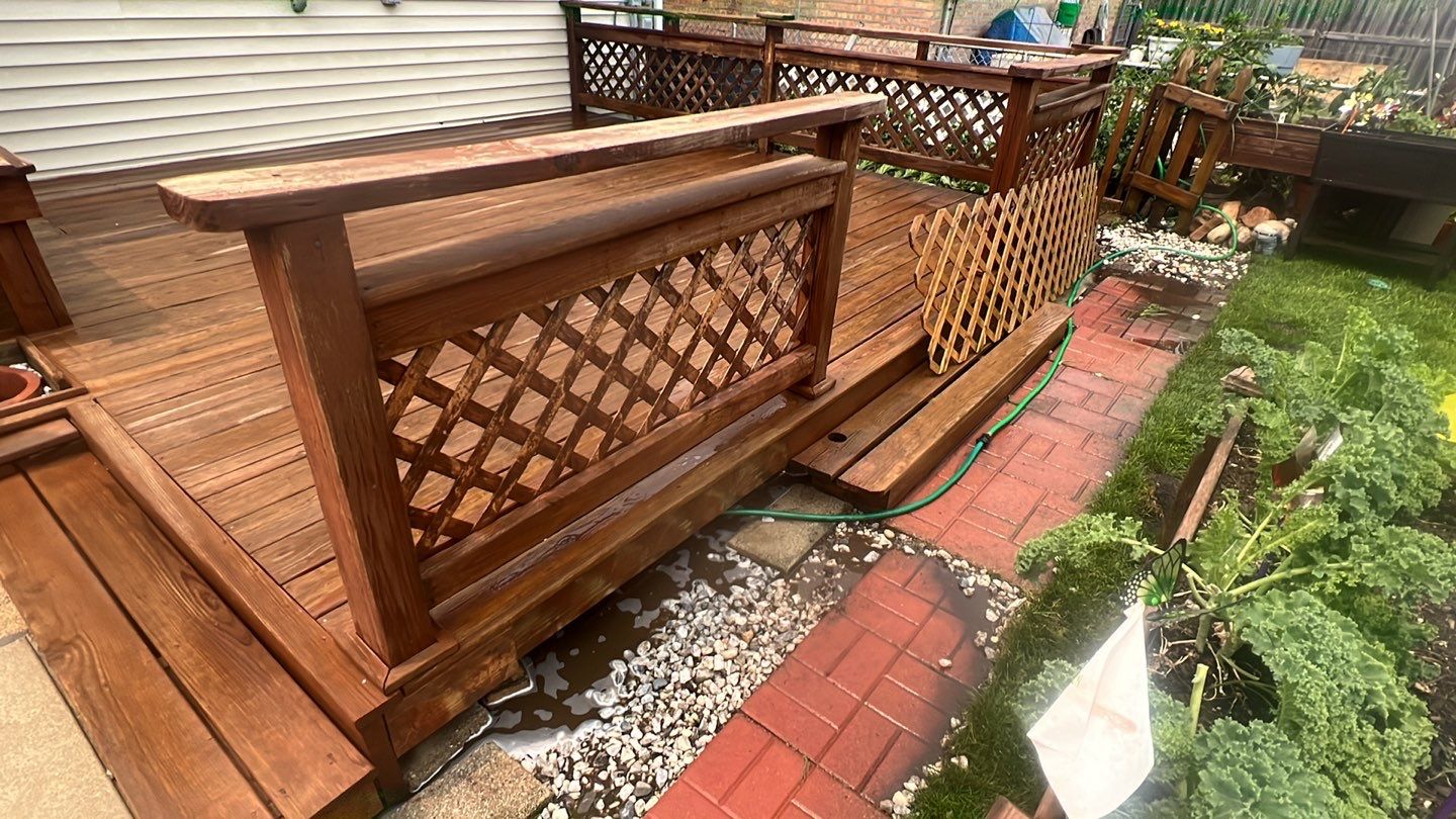 Wood cleaning and staining using Armstrong cloark oil stain by Northern Power Washing LLC.