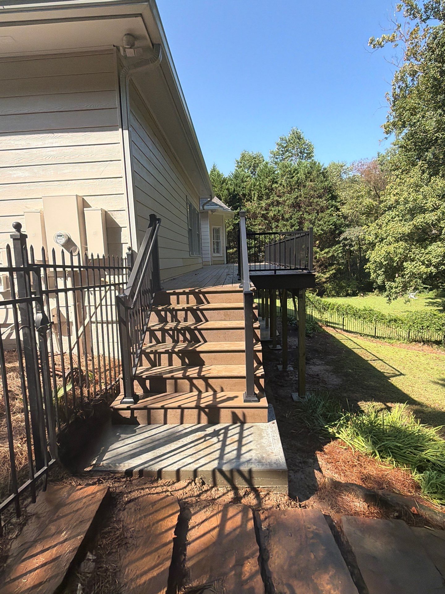 Elevated Composite Deck Replacement with Metal Railings in Smyrna by Swift Home Renovations 