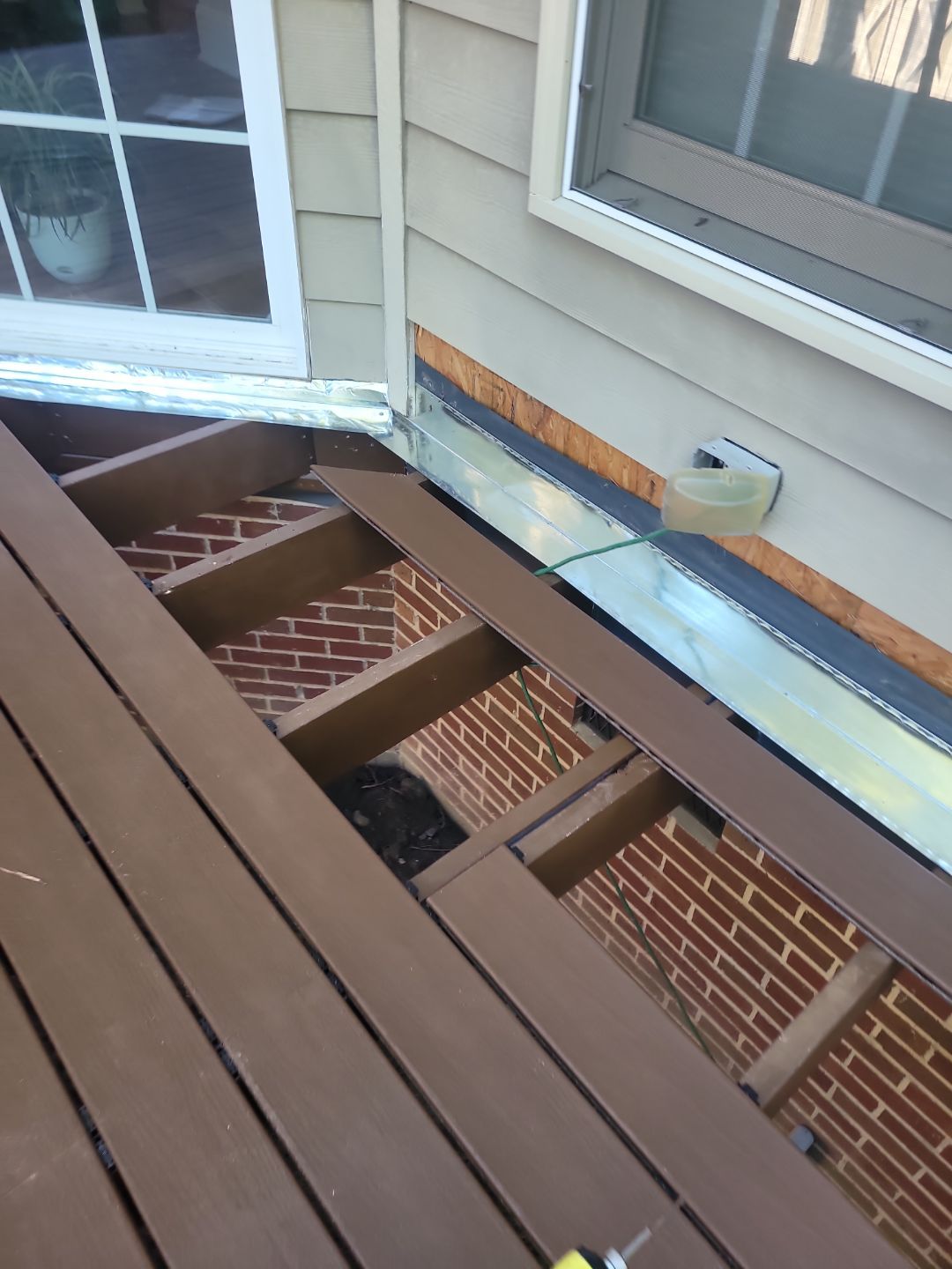 Fuquay-Varina Outdoor Upgrade – Composite Deck & Paved Landing by Elite Remodeling and Design LLC