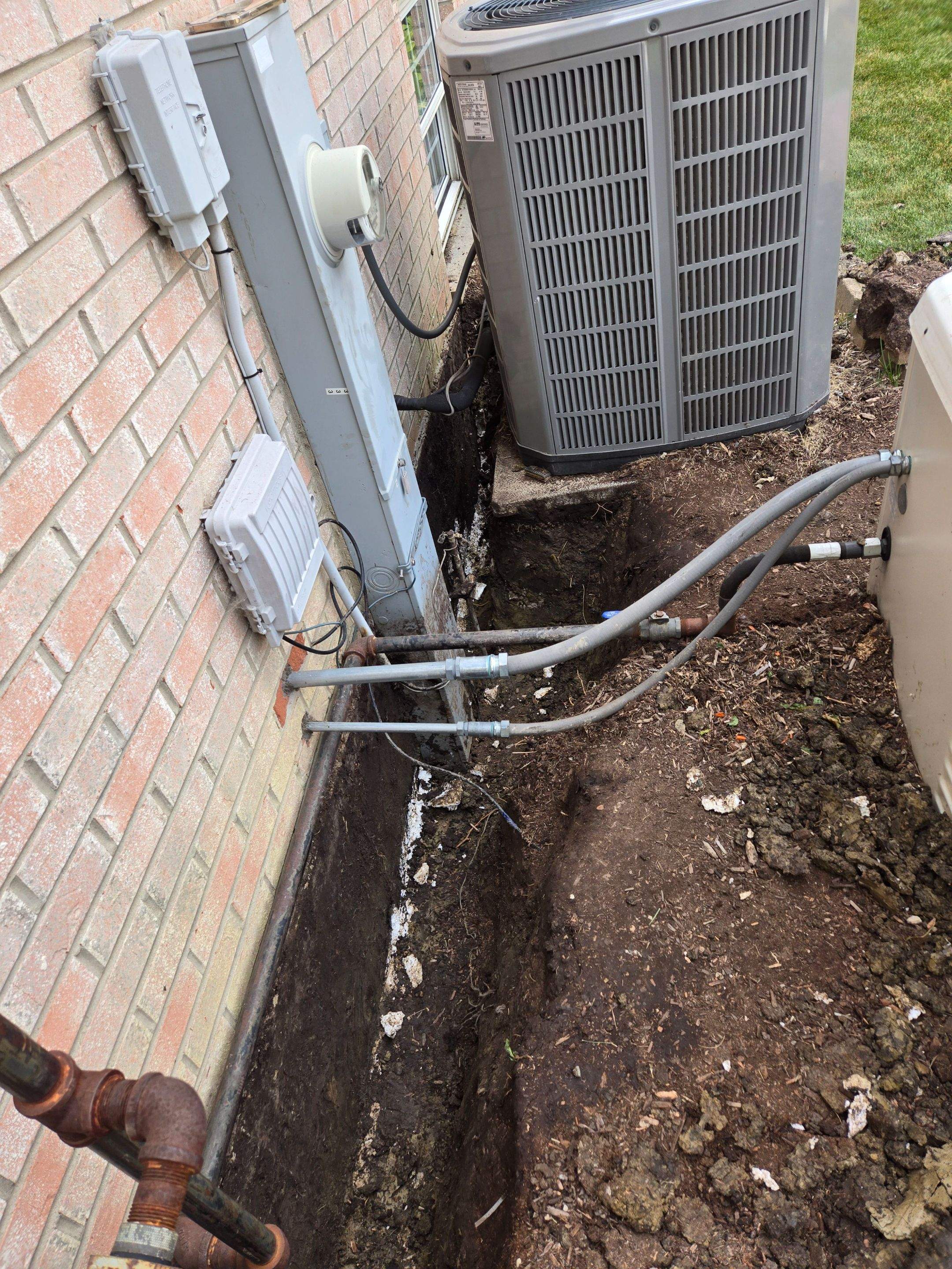 Burial of Sump Pump and Down Spout Discharges and Partial Waterproofing of Wall by Allied Water Services
