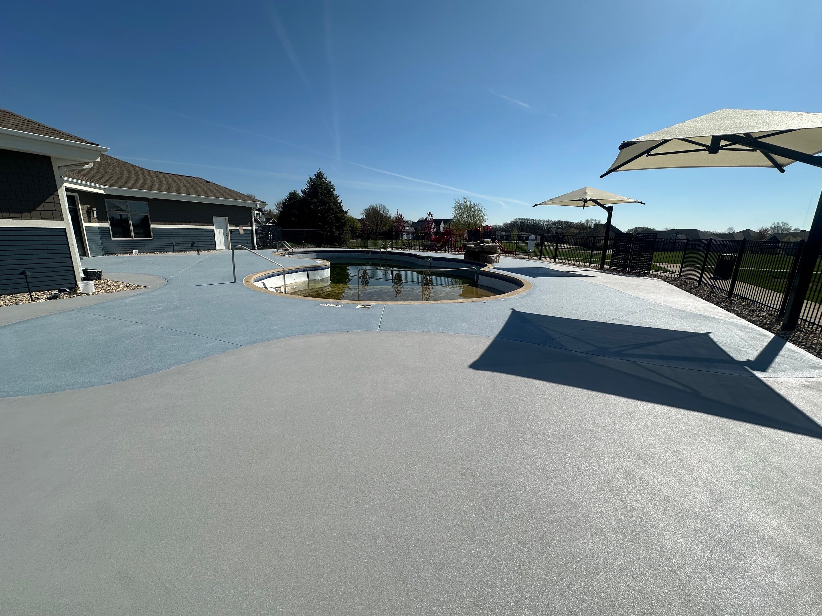 Arbors Edge Pool Deck Restoration and Textured Concrete Coating by Select Painting, Coatings & Garage Cabinets