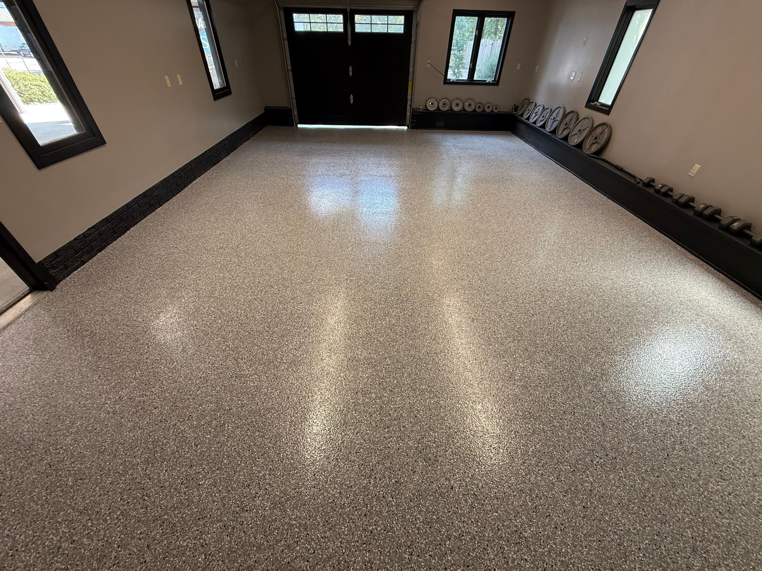 Garage Floor and Textured Pool Deck Coating in Sioux Falls by Select Painting, Coatings & Garage Cabinets