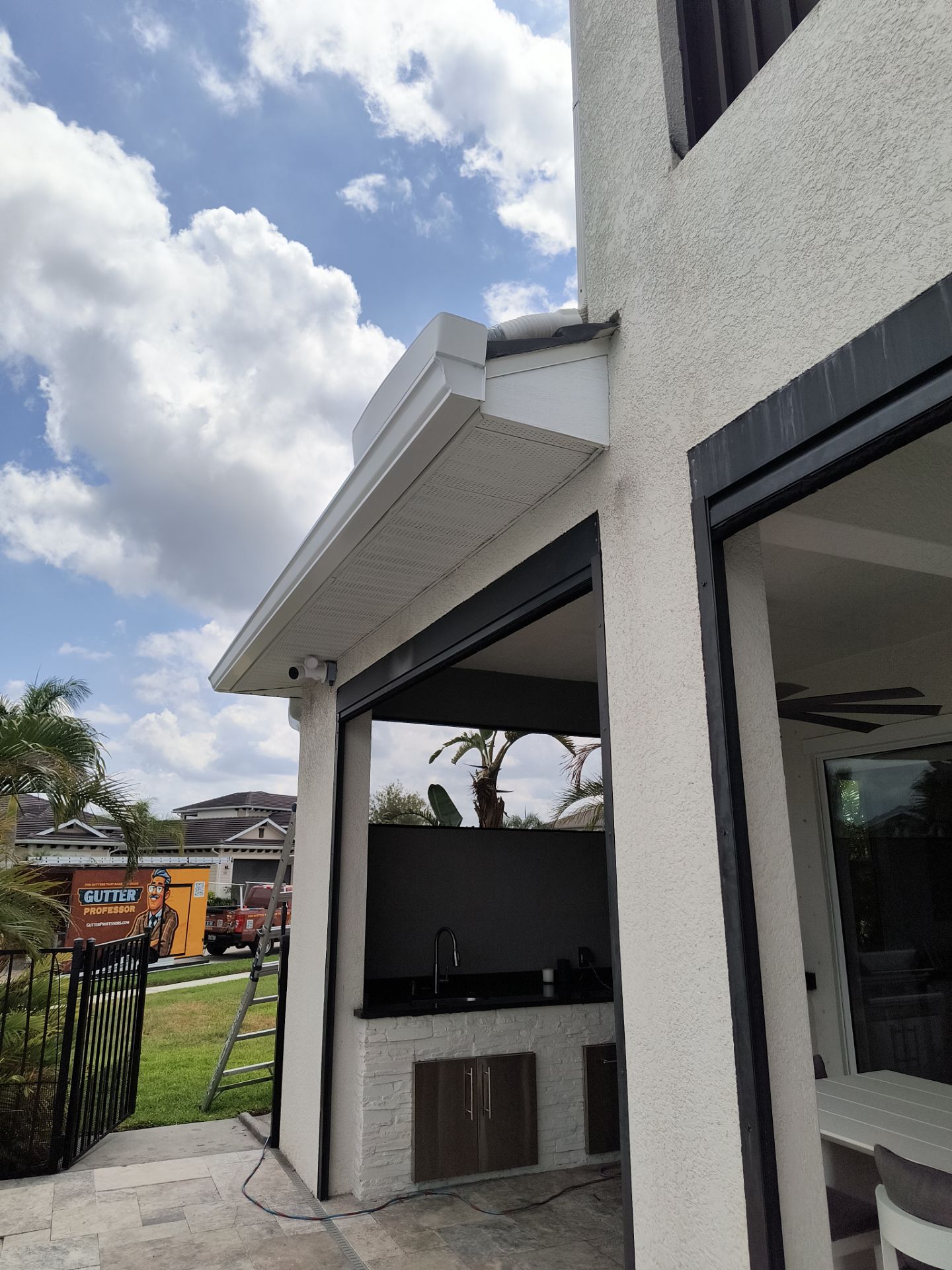 White Seamless Gutters with Downspouts in Bradenton FL by Gutter Professors