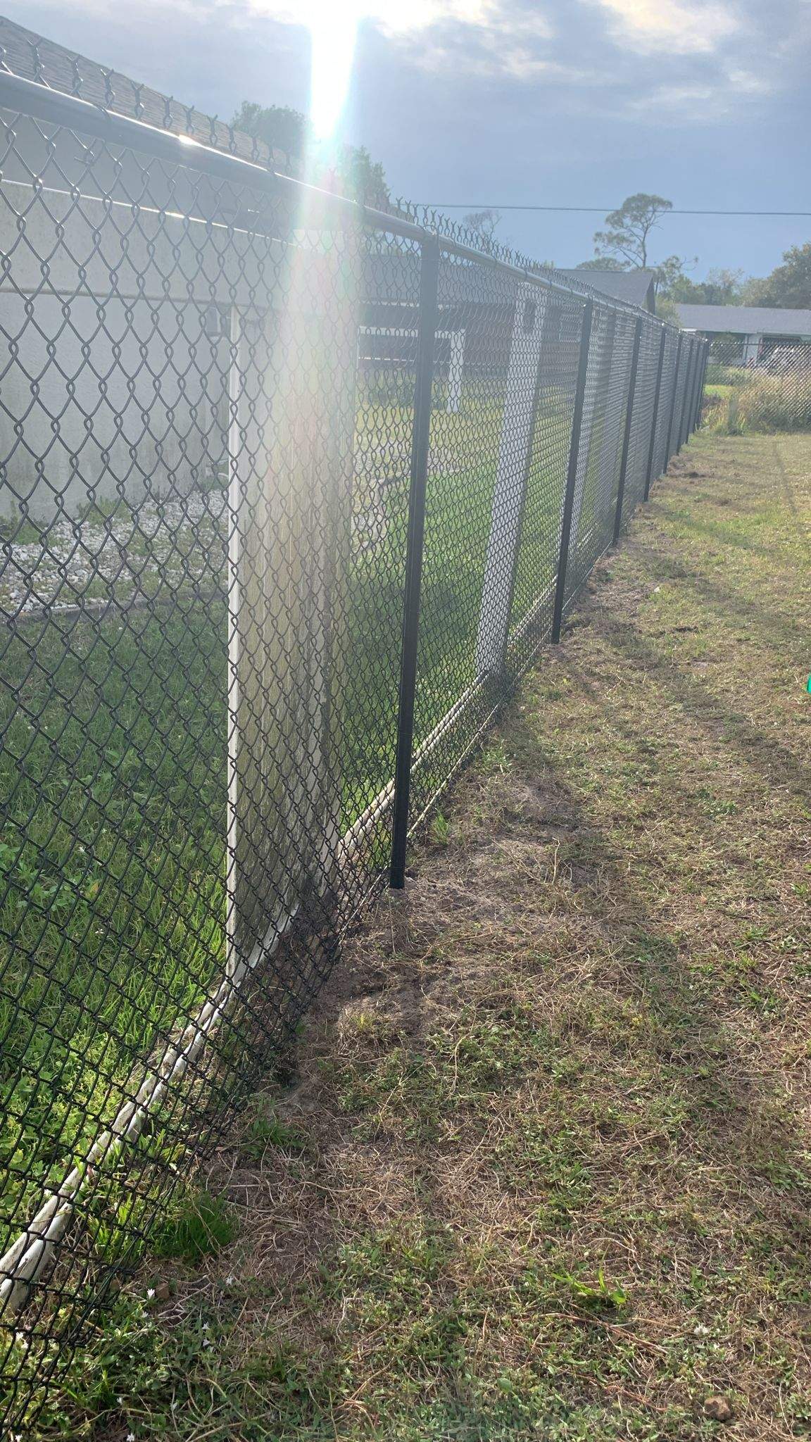 Black Vinyl-Coated Chain-Link Fence Installation in Port Charlotte by True Fence LLC