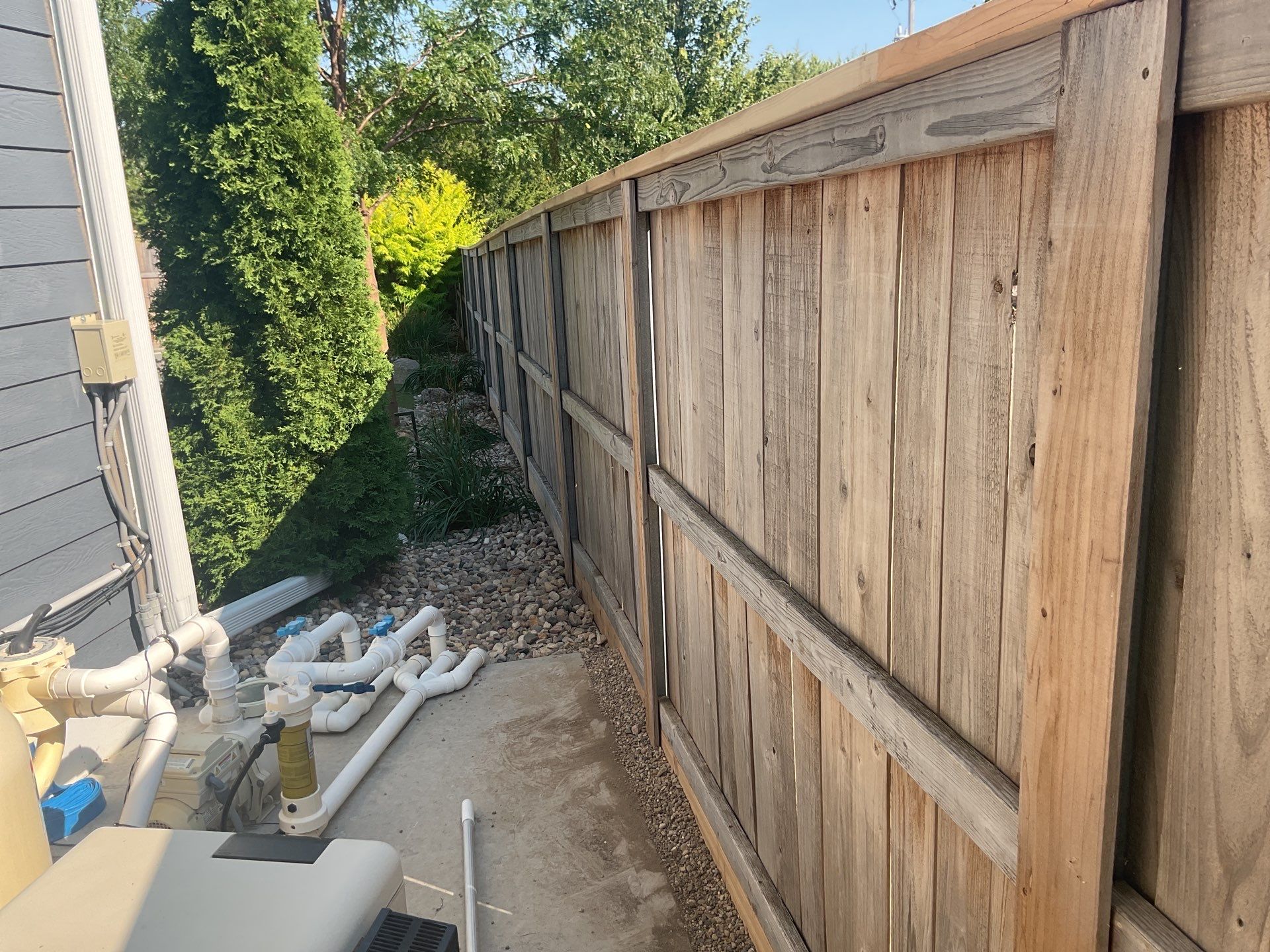 Custom Privacy Fence and Paver Patio Installation in Sioux Falls by Select Painting, Coatings & Garage Cabinets