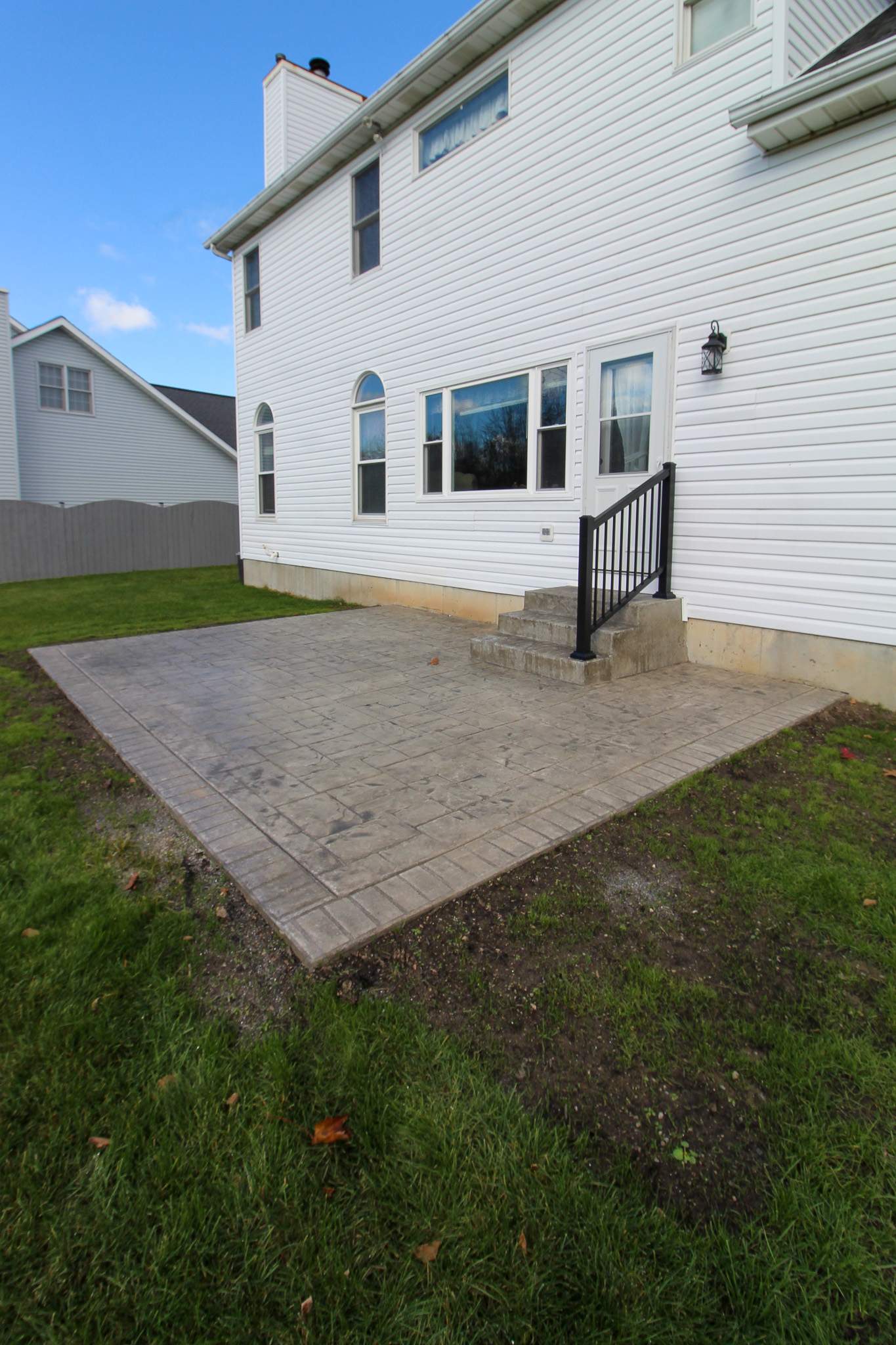 Stamped Concrete and Entry Door by Ivy Lea Construction