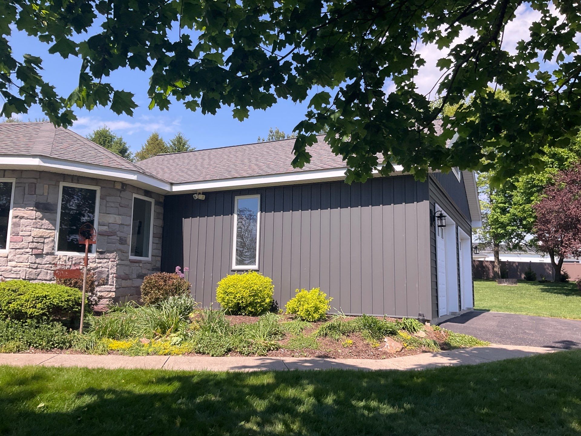 Nightfall Exterior Siding Replacement and Stone Veneer in Halifax by Esh Builders