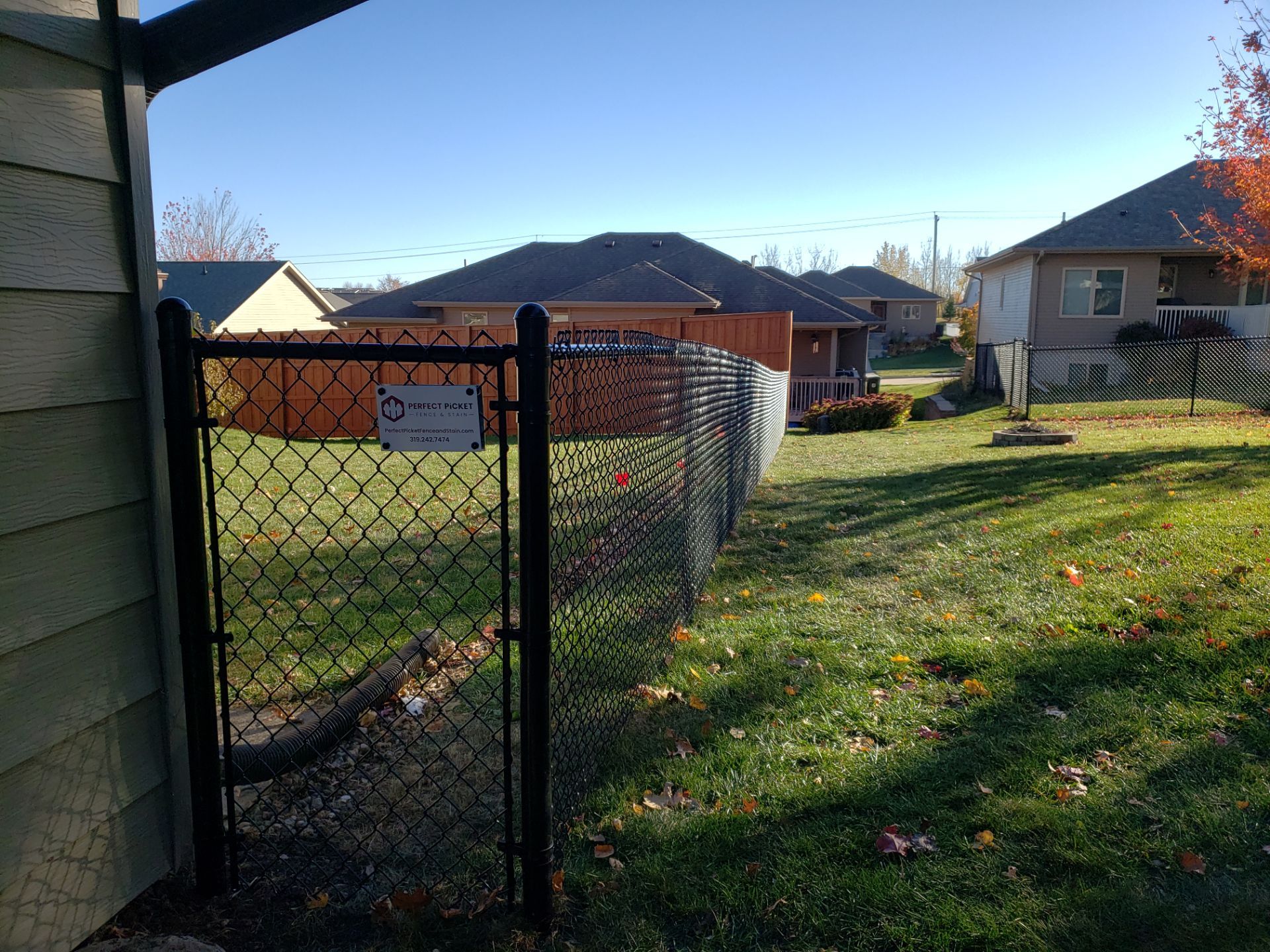 Black Chain Link Fence and Gate Installation in Cedar Falls by Perfect Picket Fence and Stain