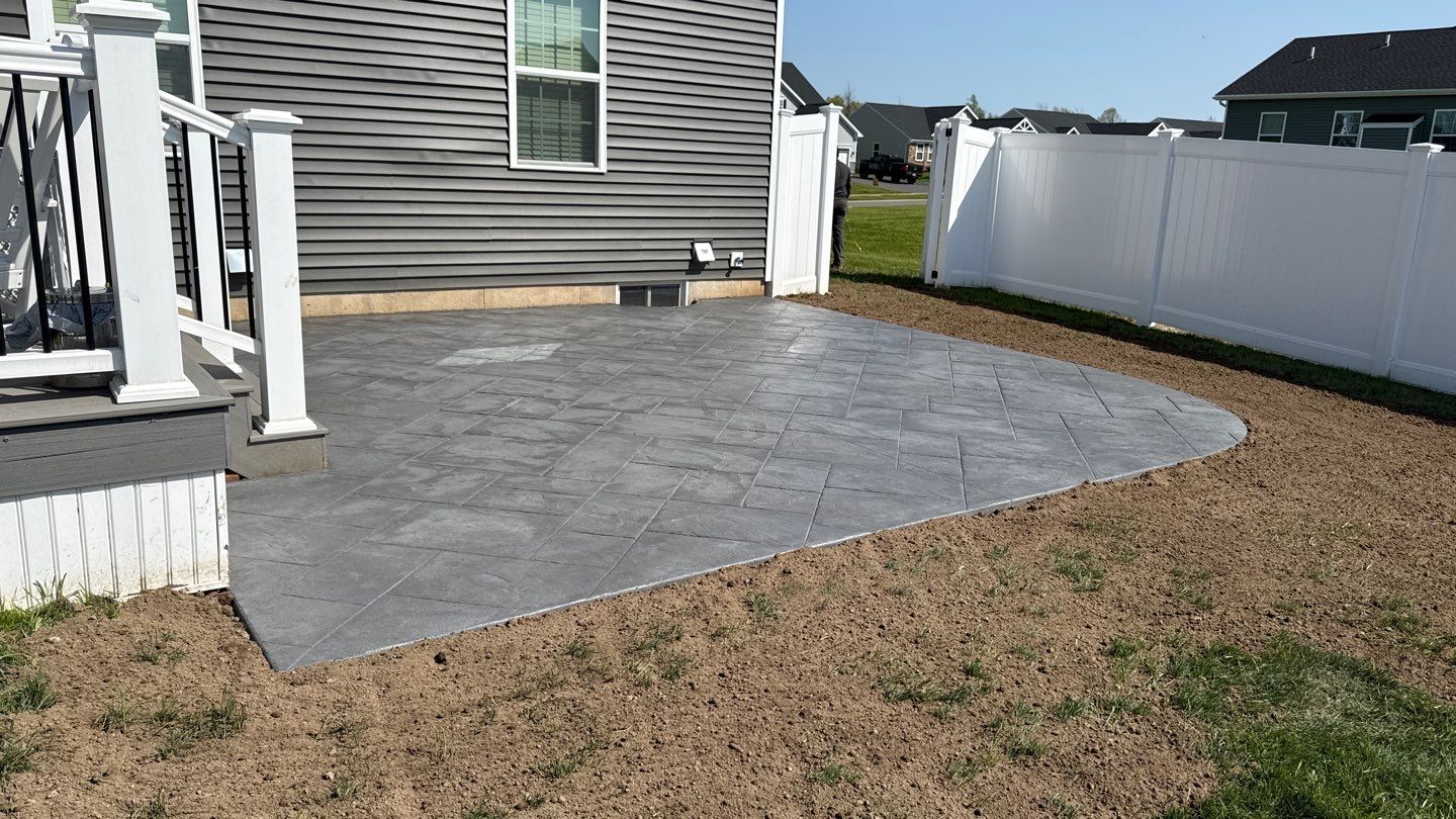 Majestic Ashlar stamped concrete patio  by NG Masonry & Construction LLC