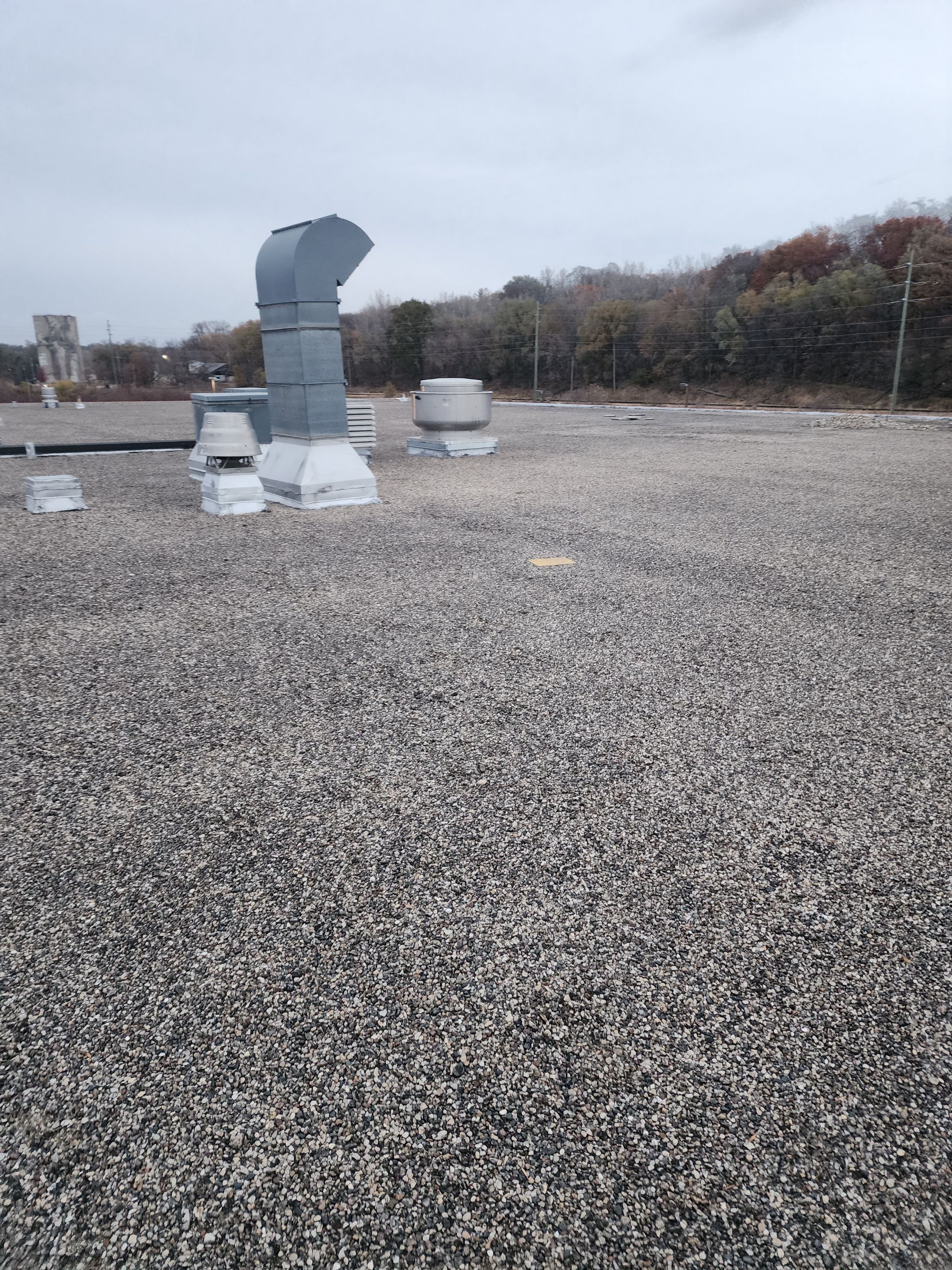 AML Riverside  by Grell Roofing, LLC